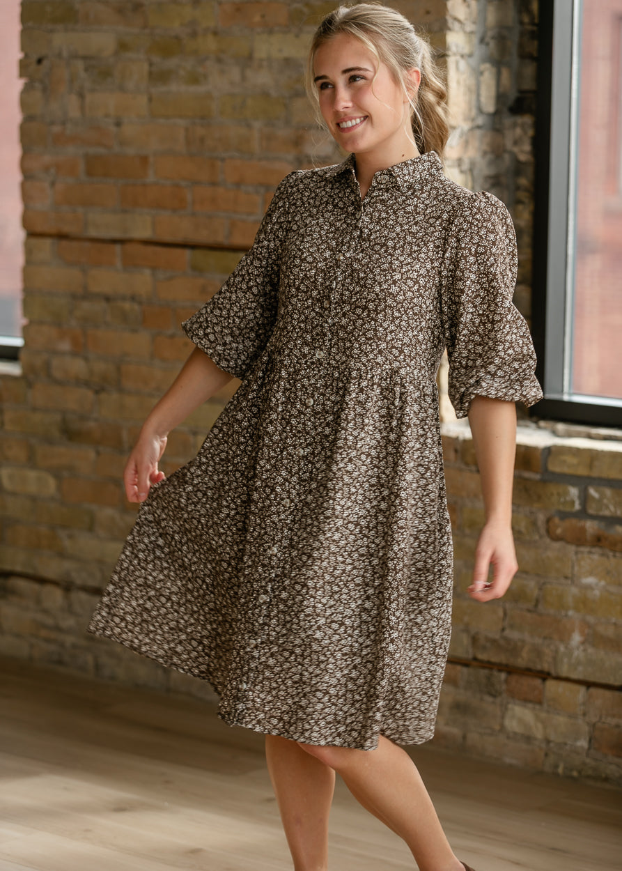 Brown floral knee-length dress styled with brown flats for an easy everyday look.