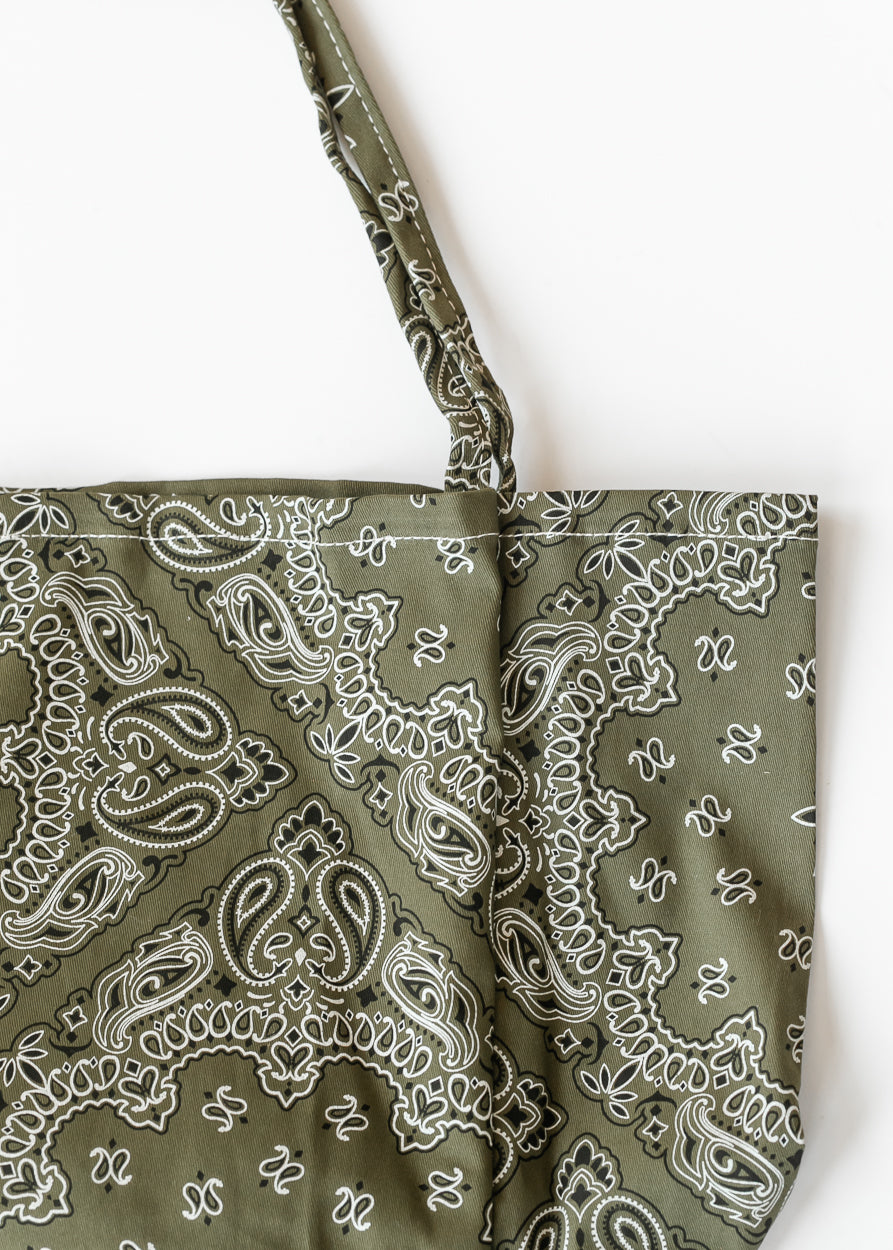 Olive floral printed canvas tote bag with cream paisley pattern, open top, and matching shoulder straps.
