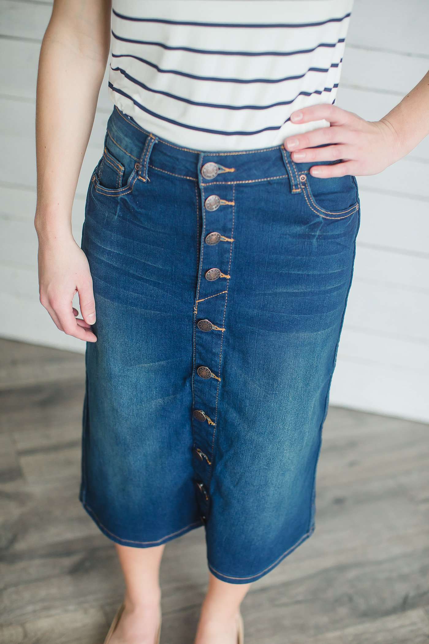 Modest women's denim midi skirt. Four buttons down the front, also pockets front and back.