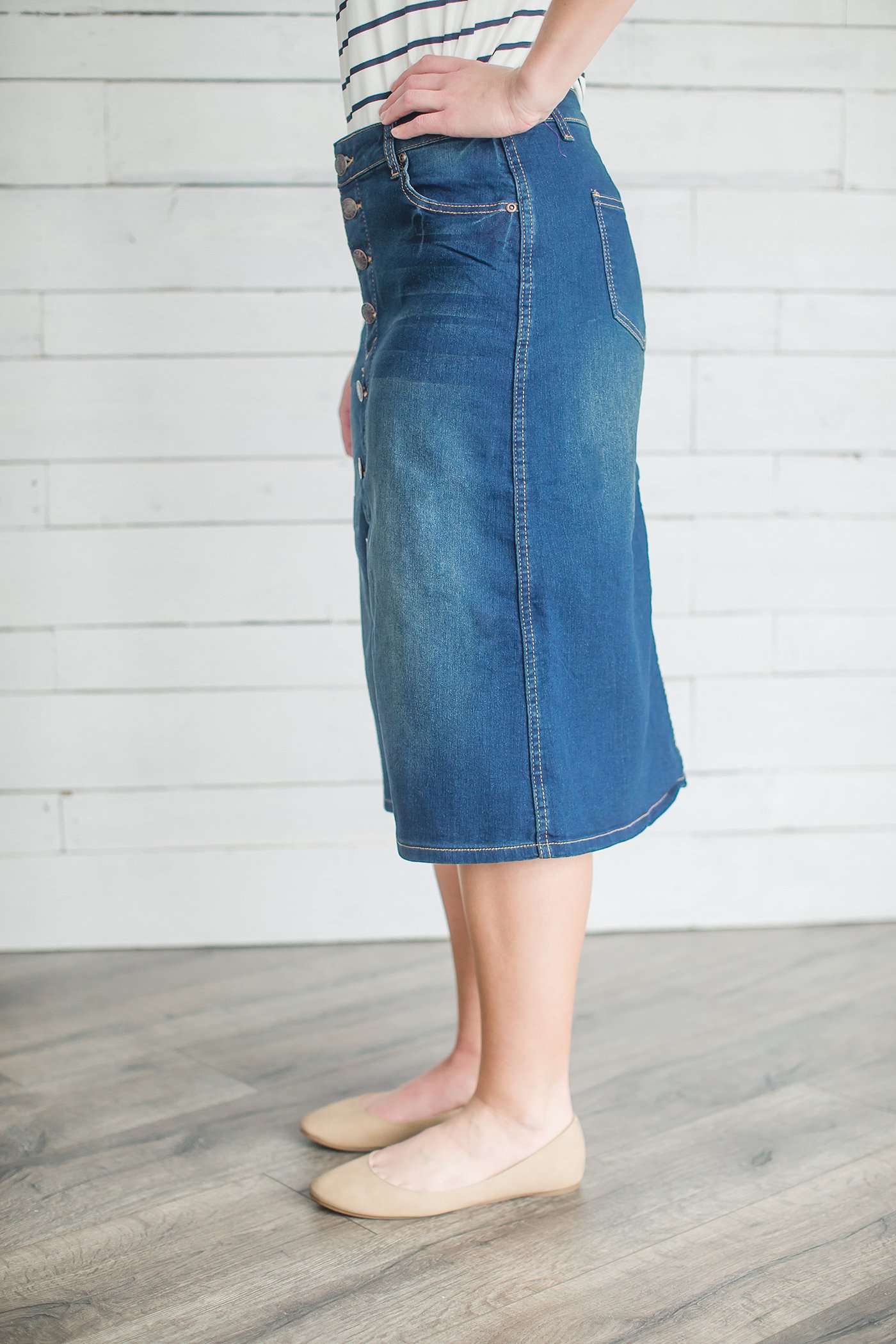 Modest women's denim midi skirt. Four buttons down the front, also pockets front and back.