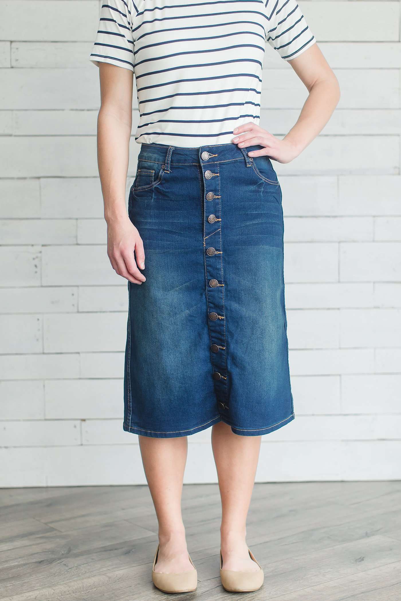 Modest women's denim midi skirt. Four buttons down the front, also pockets front and back.