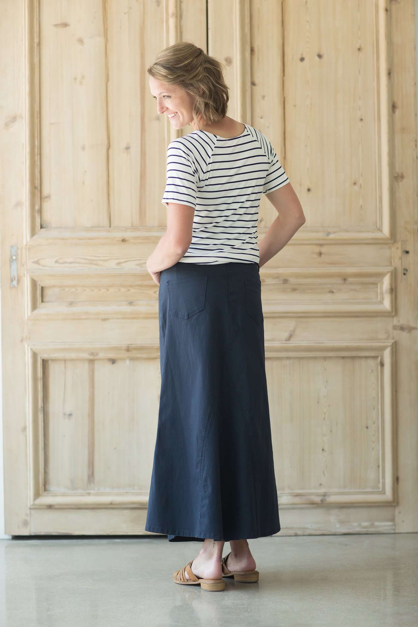 Shop this long, modest navy skirt with a beautiful a-line insert.
