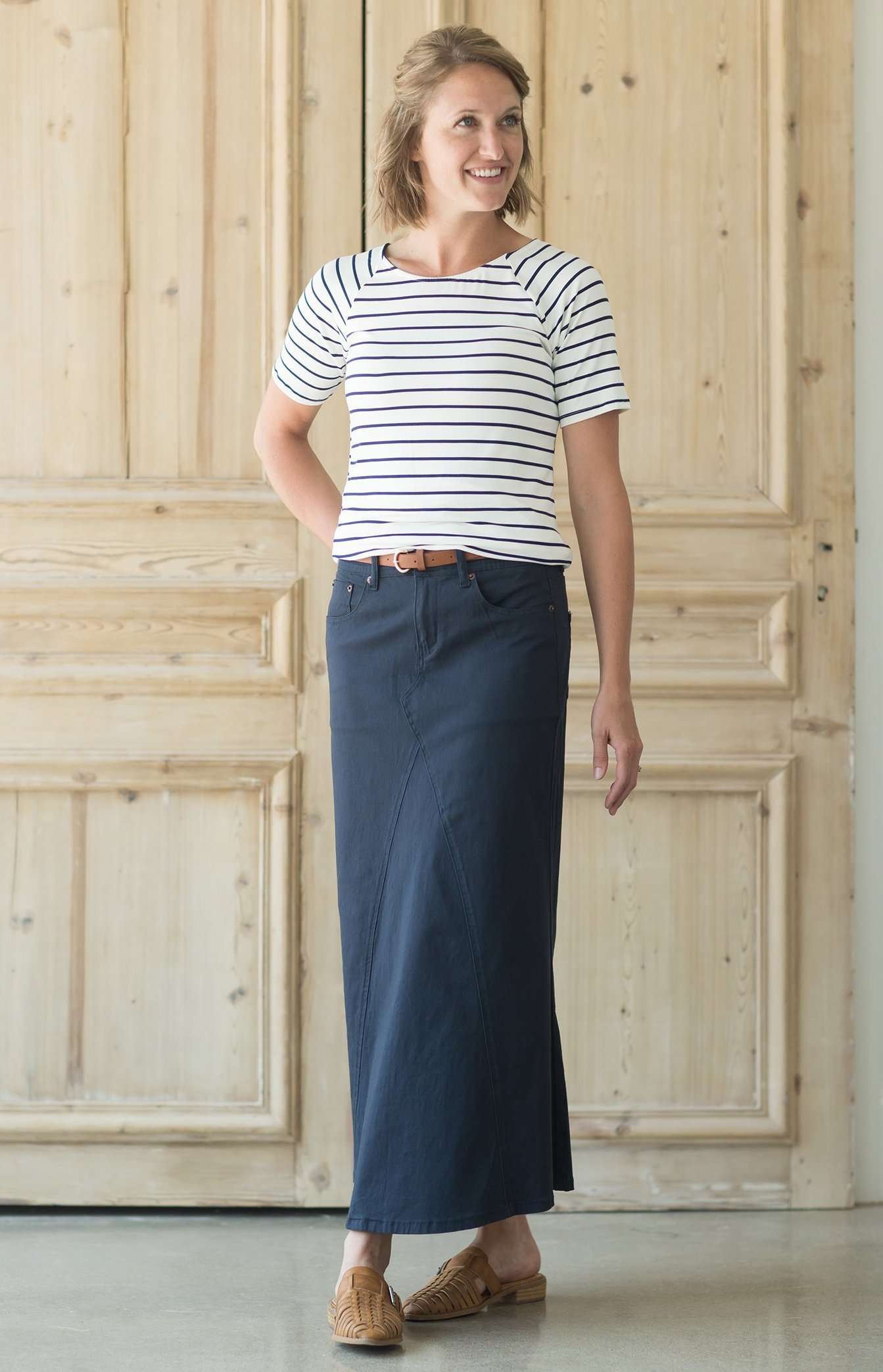 Shop this long, modest navy skirt with a beautiful a-line insert.