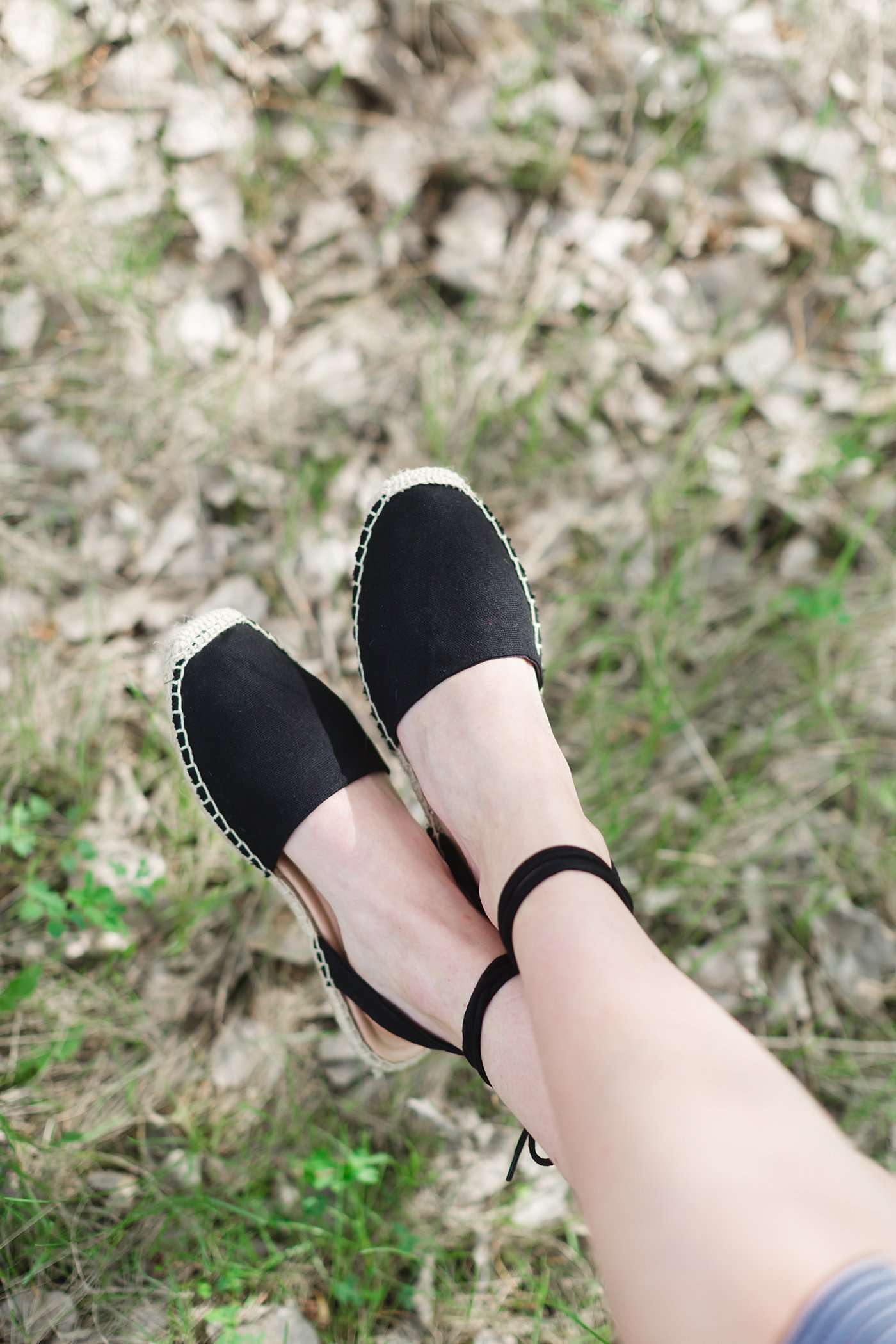 Black ankle wrap sandal with closed-toe and strap back open-heel.