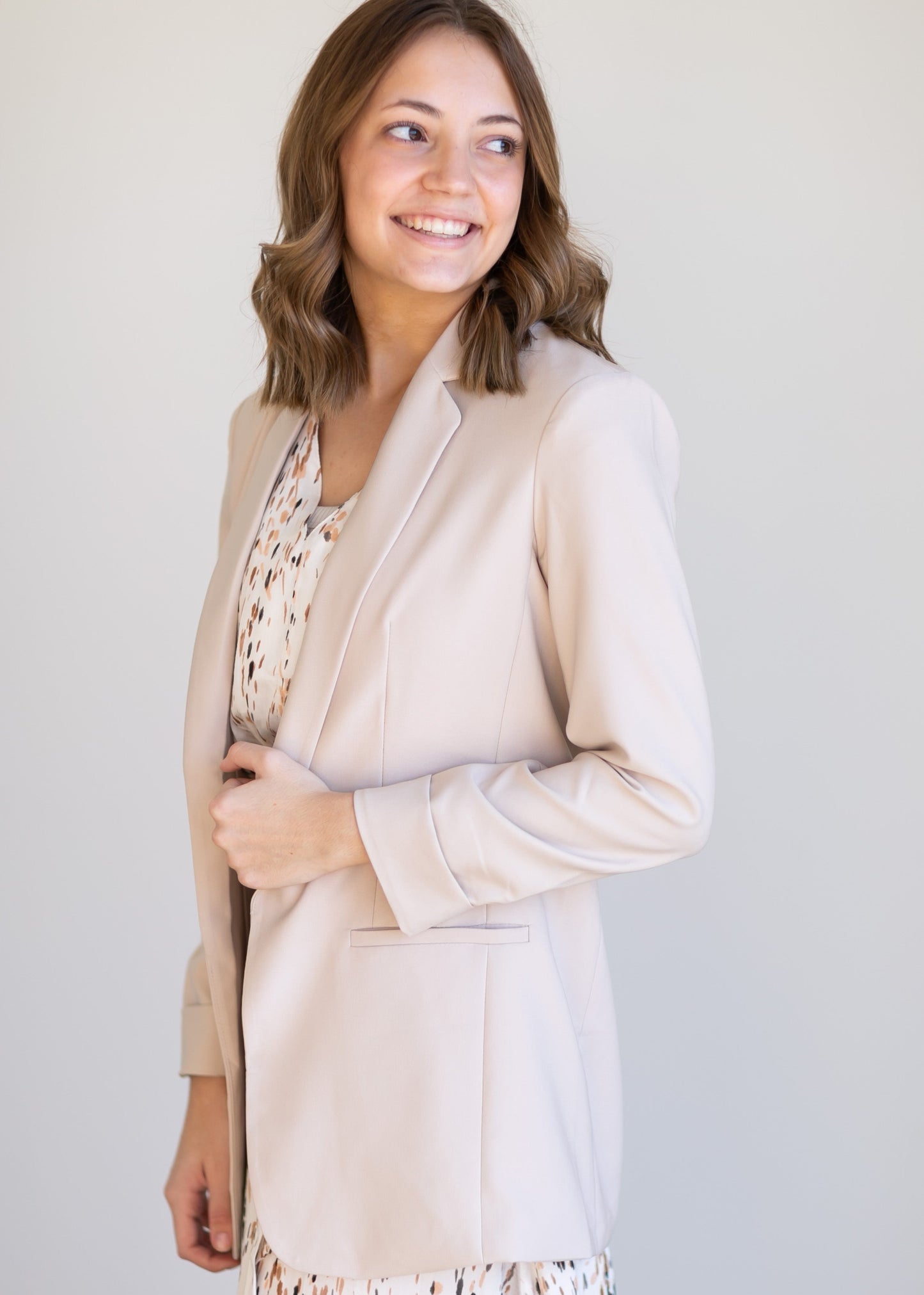 Basic Open Front Blazer features classic lapel collar, rolled up cuffs, and flat front hip pockets. This blazer is lined for a sleek fit.
