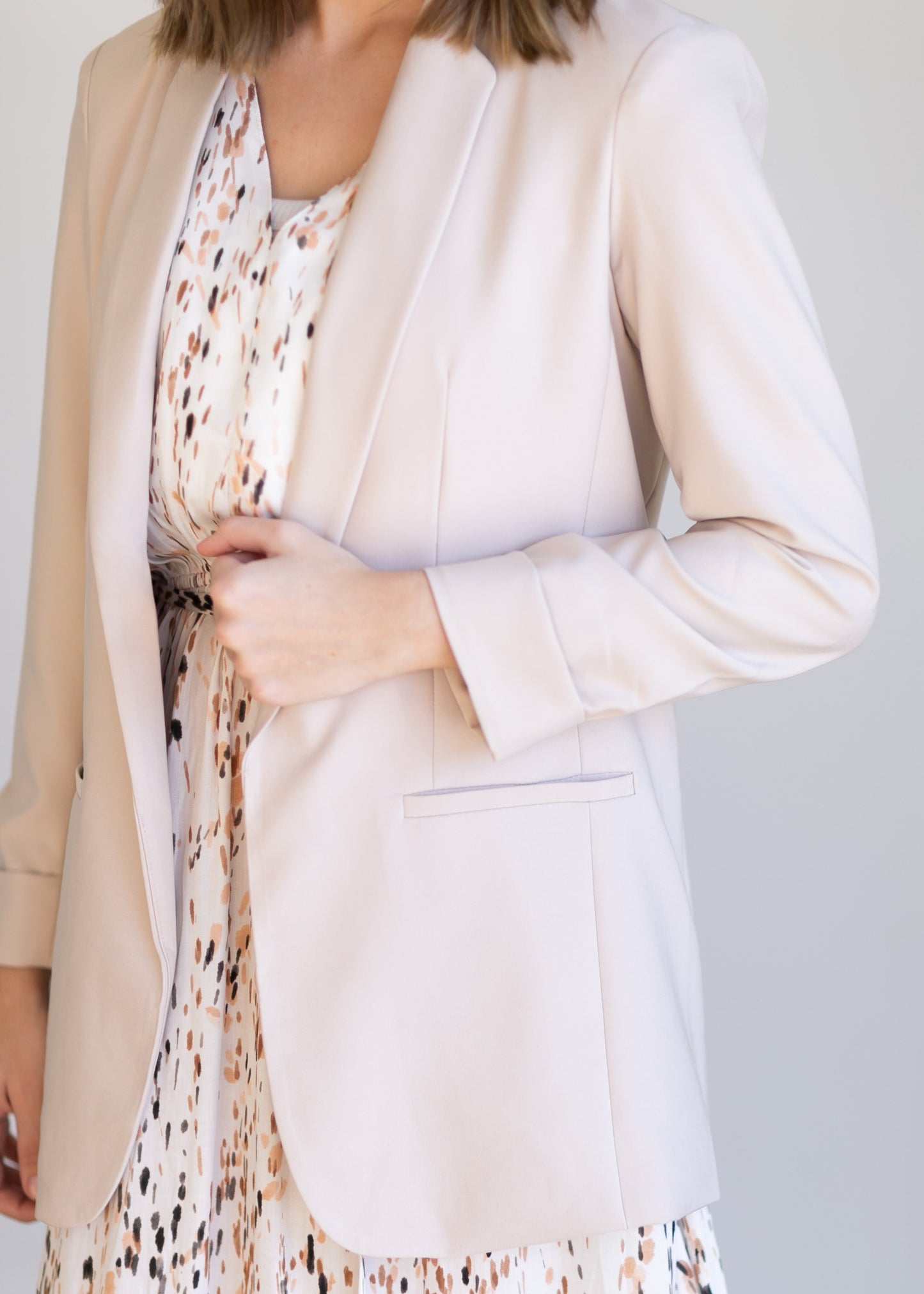 Basic Open Front Blazer features classic lapel collar, rolled up cuffs, and flat front hip pockets. This blazer is lined for a sleek fit.
