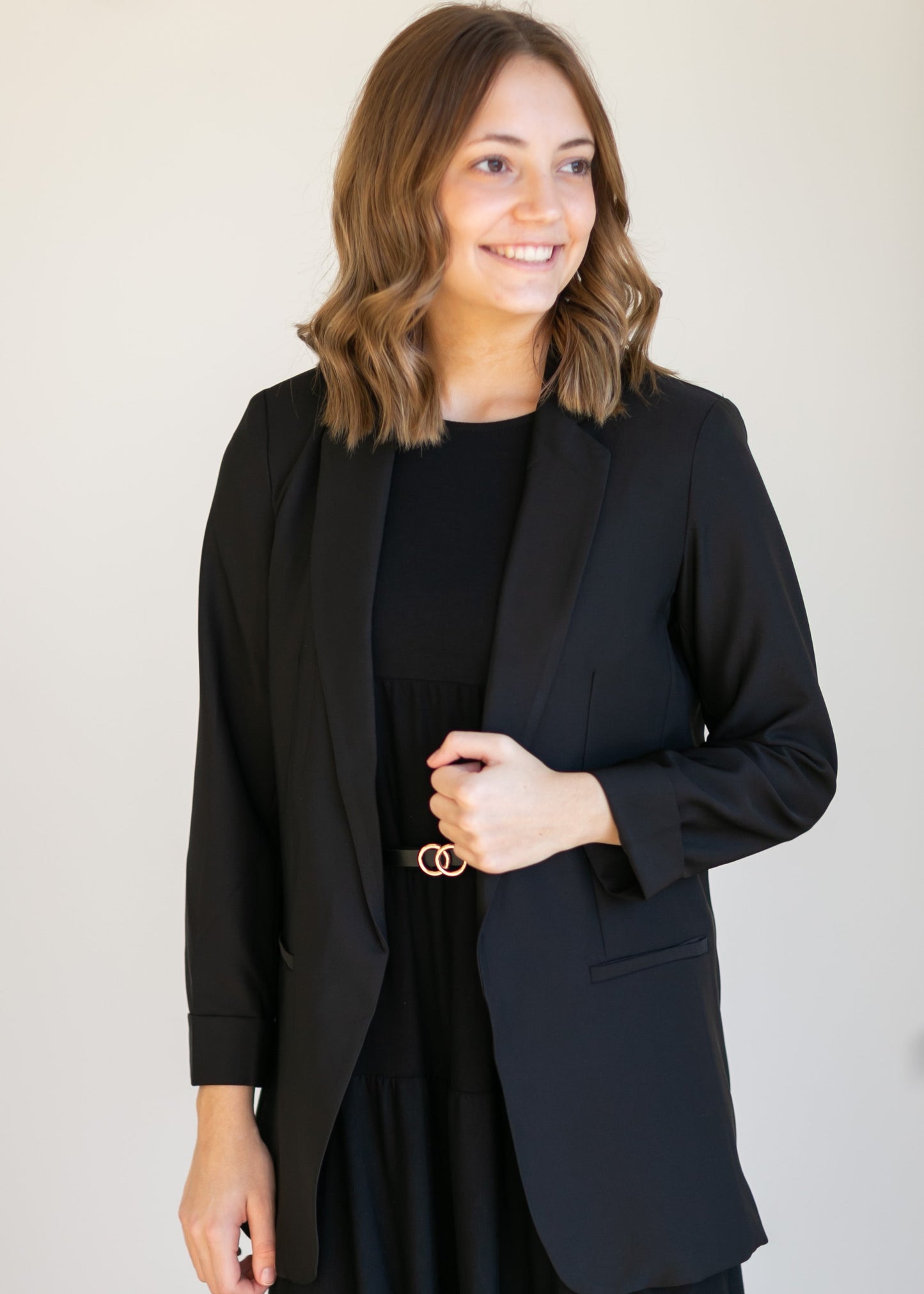 Basic Open Front Blazer features classic lapel collar, rolled up cuffs, and flat front hip pockets. This blazer is lined for a sleek fit.
