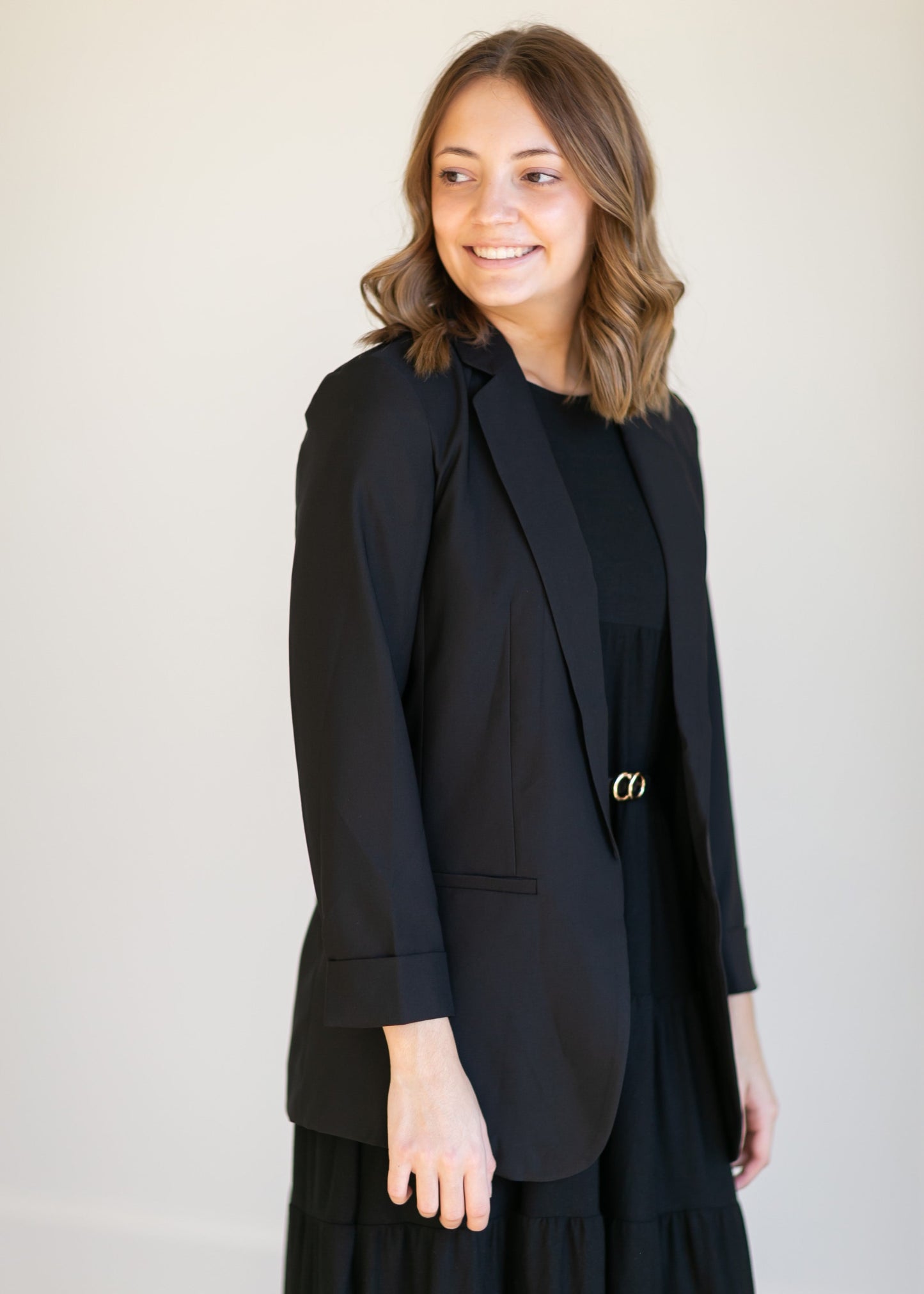 Basic Open Front Blazer features classic lapel collar, rolled up cuffs, and flat front hip pockets. This blazer is lined for a sleek fit.