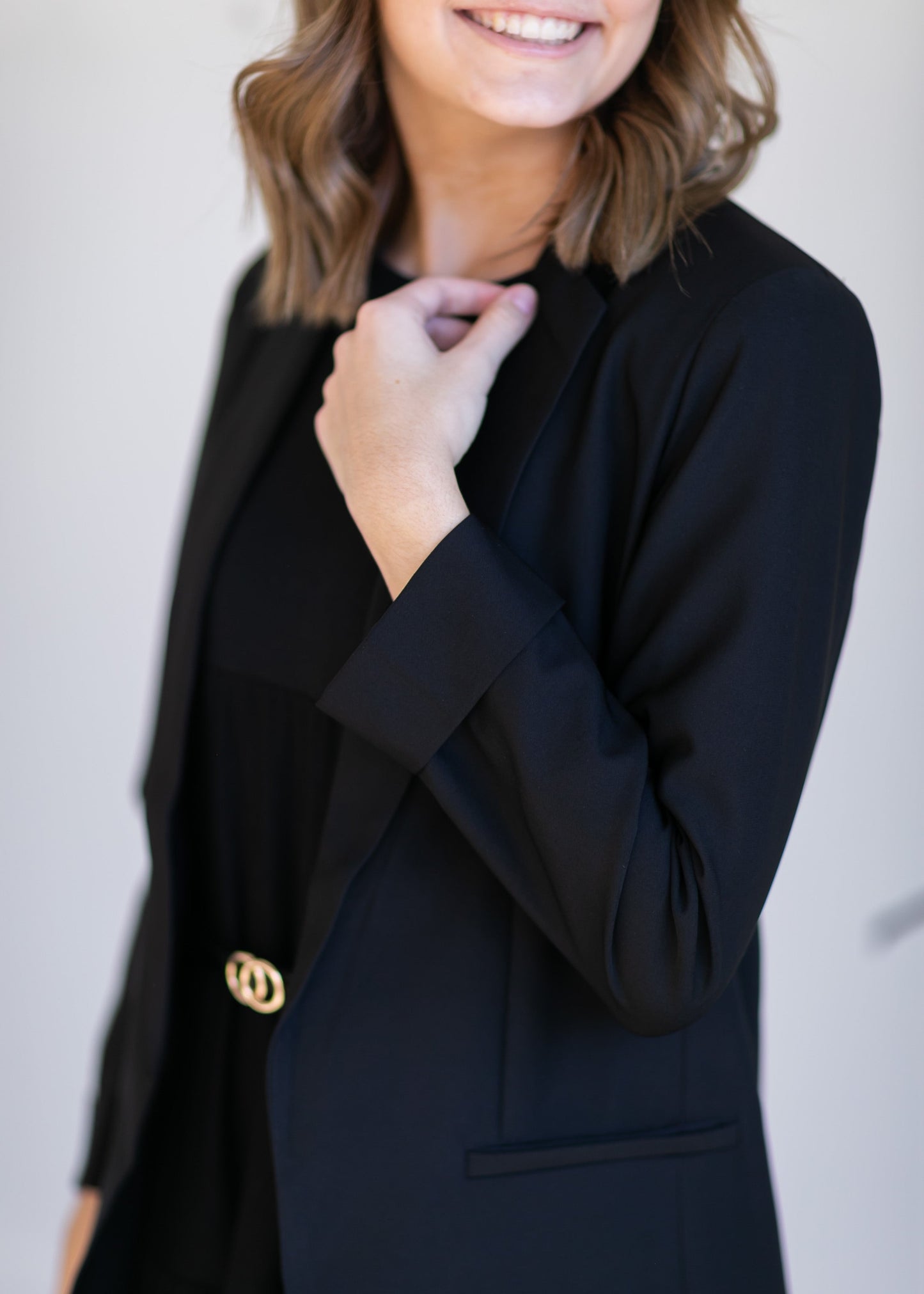 Basic Open Front Blazer features classic lapel collar, rolled up cuffs, and flat front hip pockets. This blazer is lined for a sleek fit.