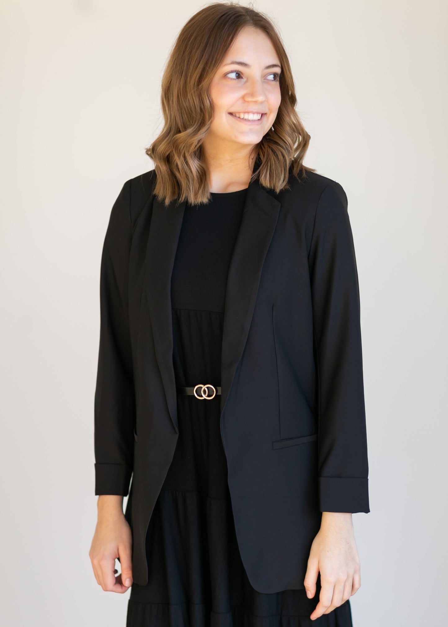 Basic Open Front Blazer features classic lapel collar, rolled up cuffs, and flat front hip pockets. This blazer is lined for a sleek fit.