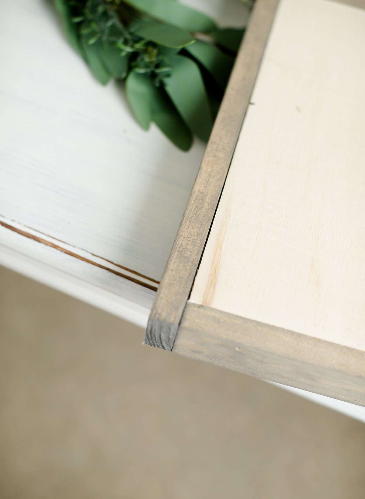 Wood Frame Signboard with the words, "Be Still" written on it in script font.