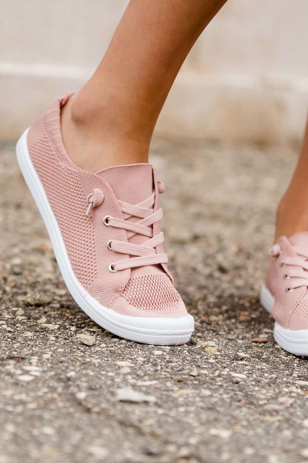 Blush or grey option mesh slip on, laced up shoe. Either color has a white sole.