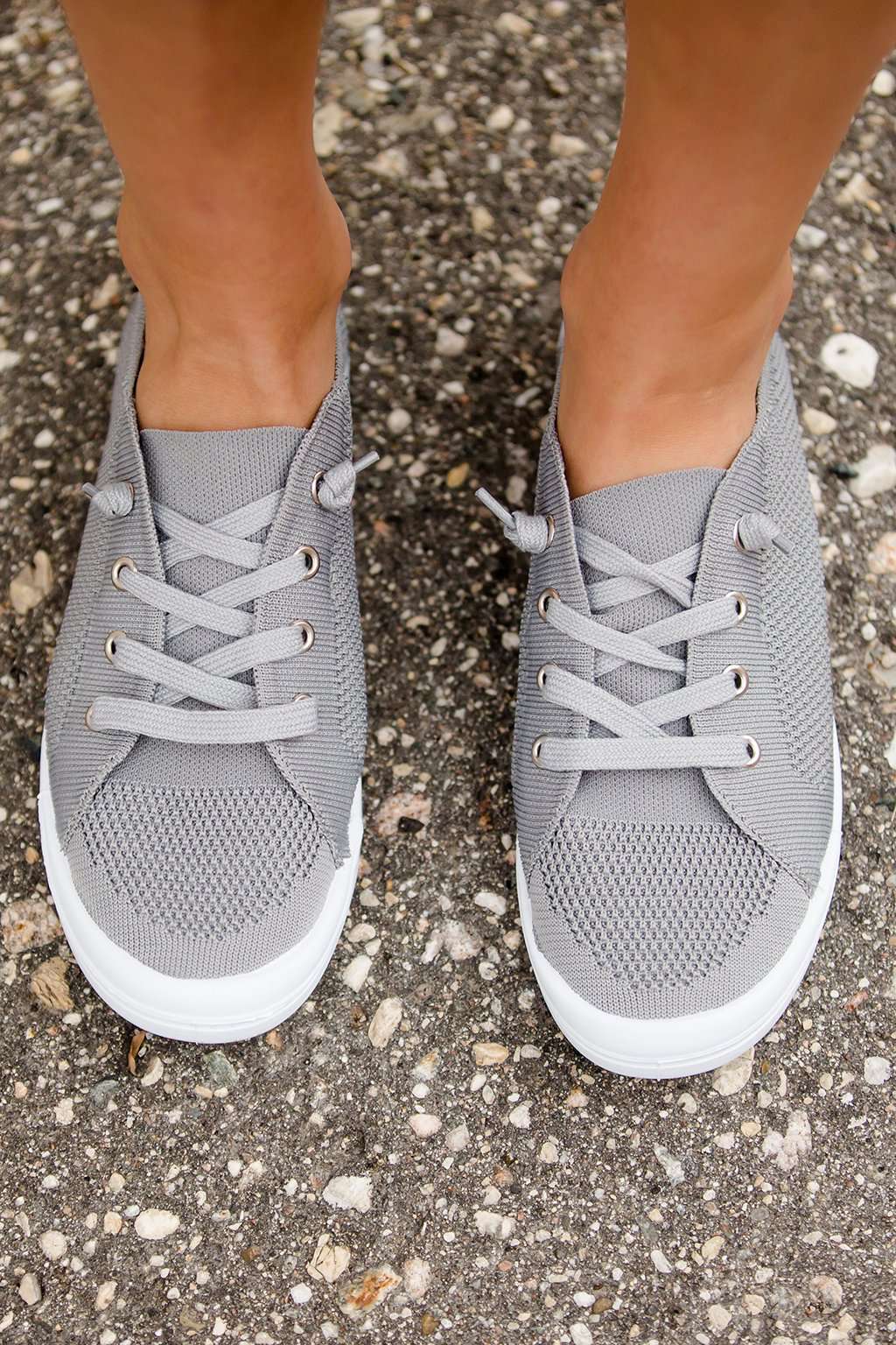 Blush or grey option mesh slip on, laced up shoe. Either color has a white sole.