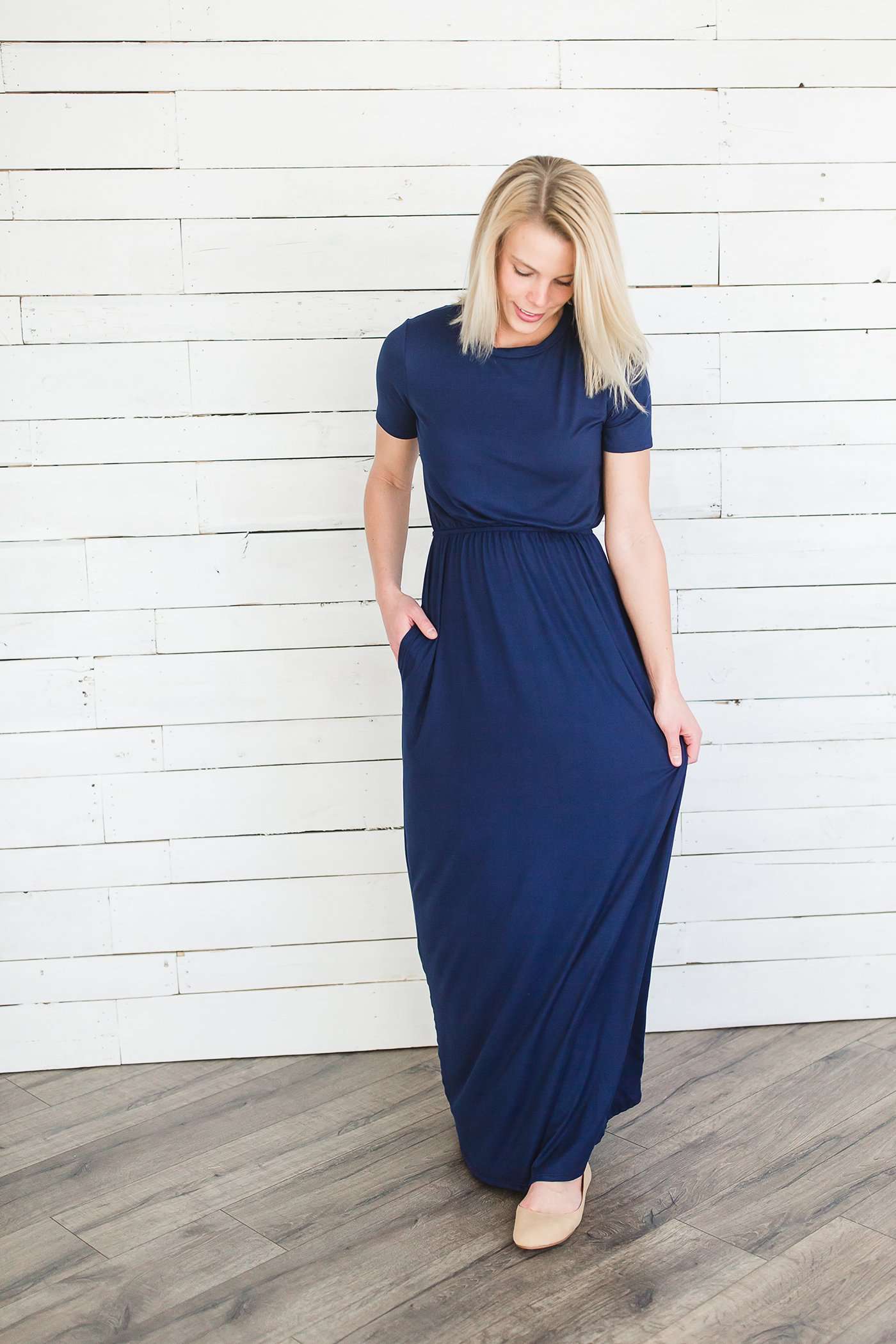 Modest women's maxi dress in peach, navy or black. 2 hidden side seam pockets, elastic waist and short sleeves.