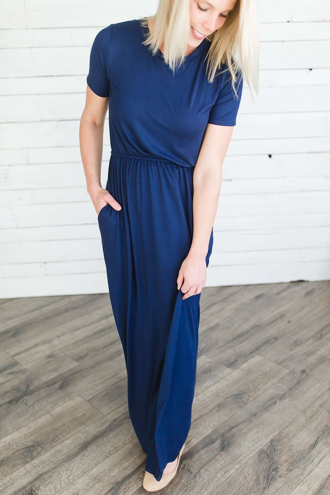 Modest women's maxi dress in peach, navy or black. 2 hidden side seam pockets, elastic waist and short sleeves.