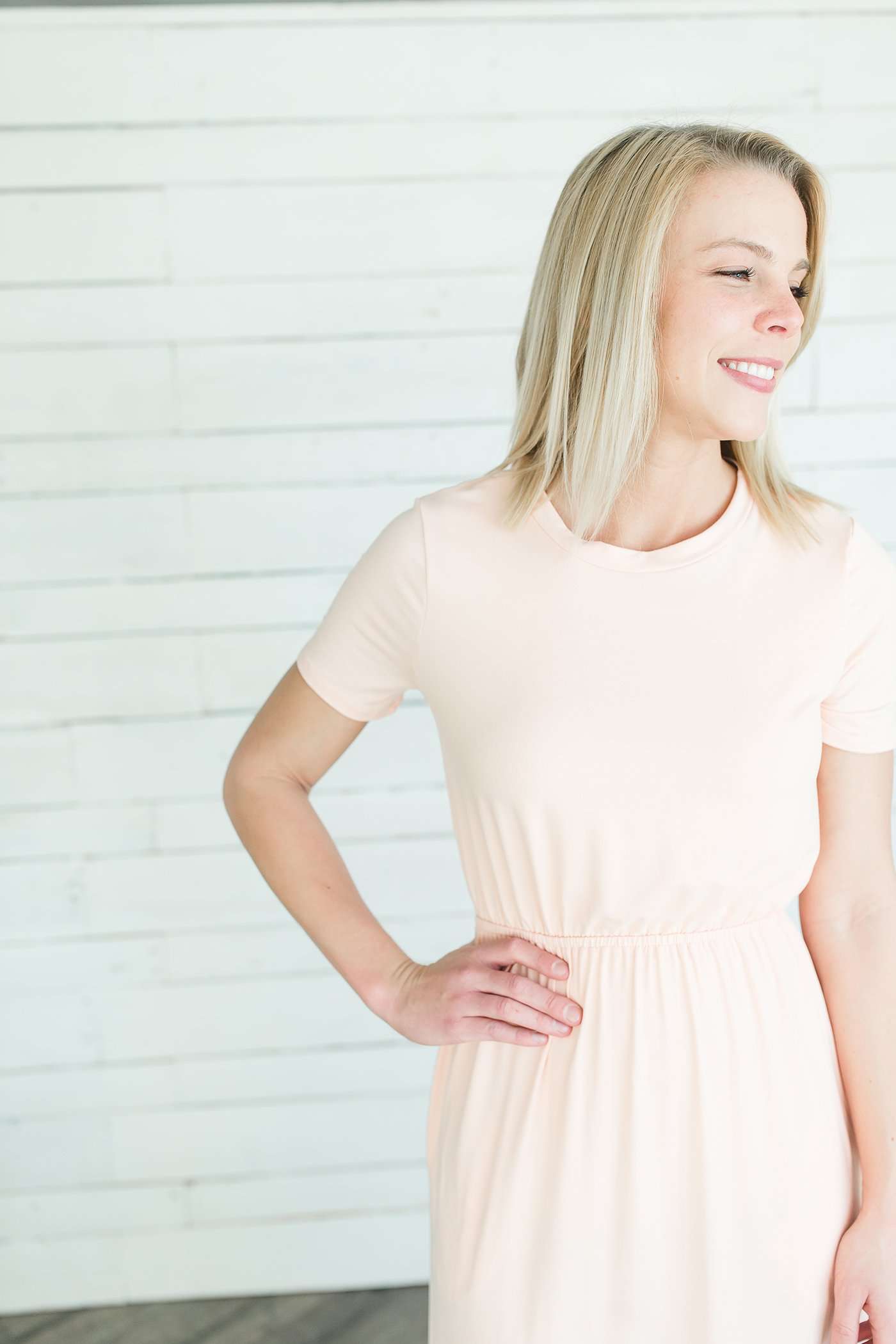 Modest women's maxi dress in peach, navy or black. 2 hidden side seam pockets, elastic waist and short sleeves.