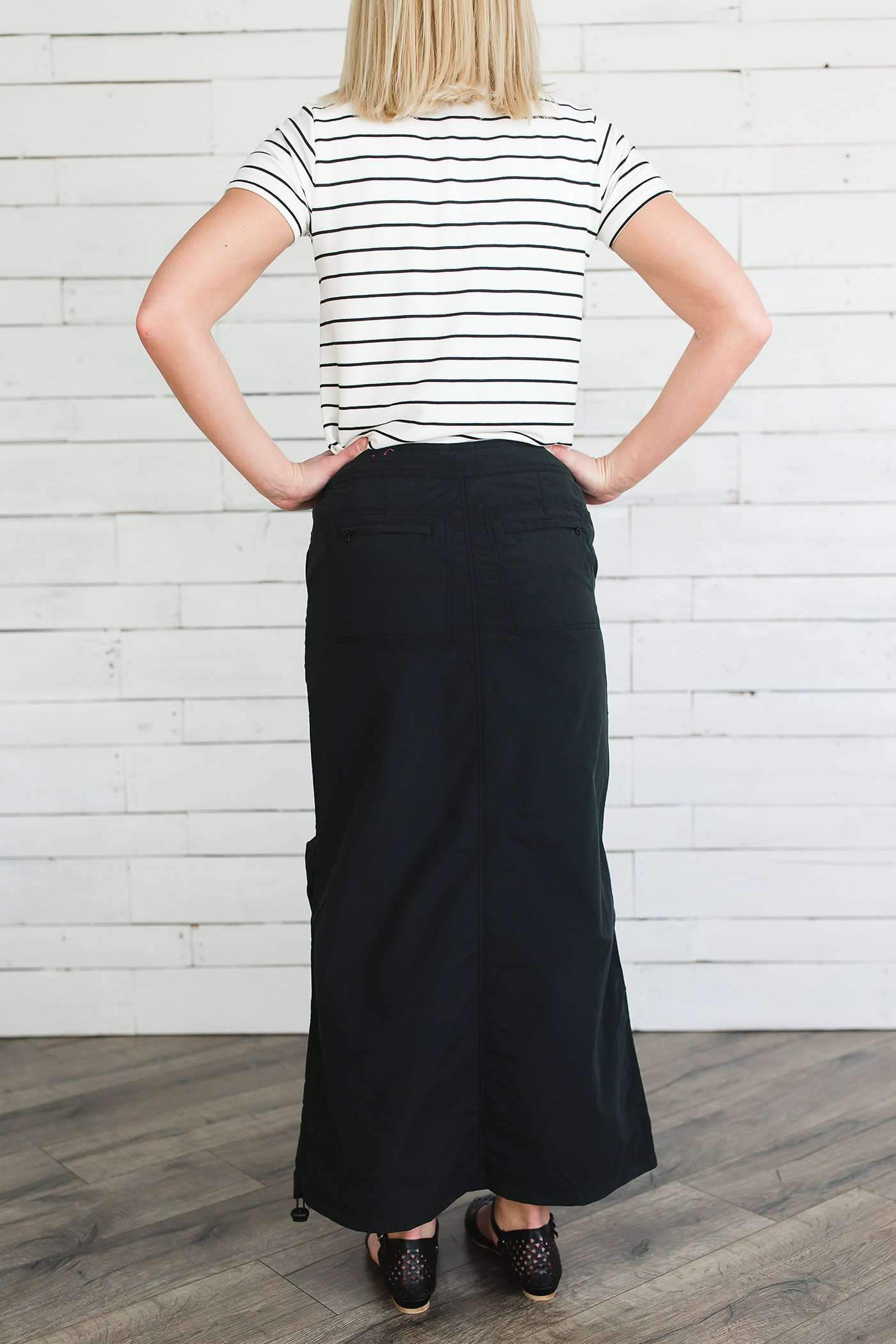 Black, tan or olive option in this long skirt with drawstring waist and side strings to adjust height from midi to maxi