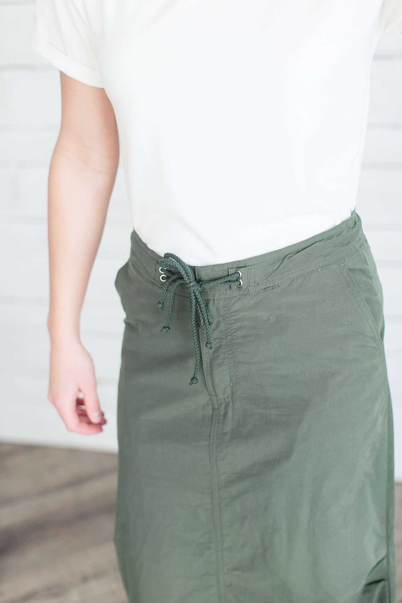 Black, tan or olive option in this long skirt with drawstring waist and side strings to adjust height from midi to maxi