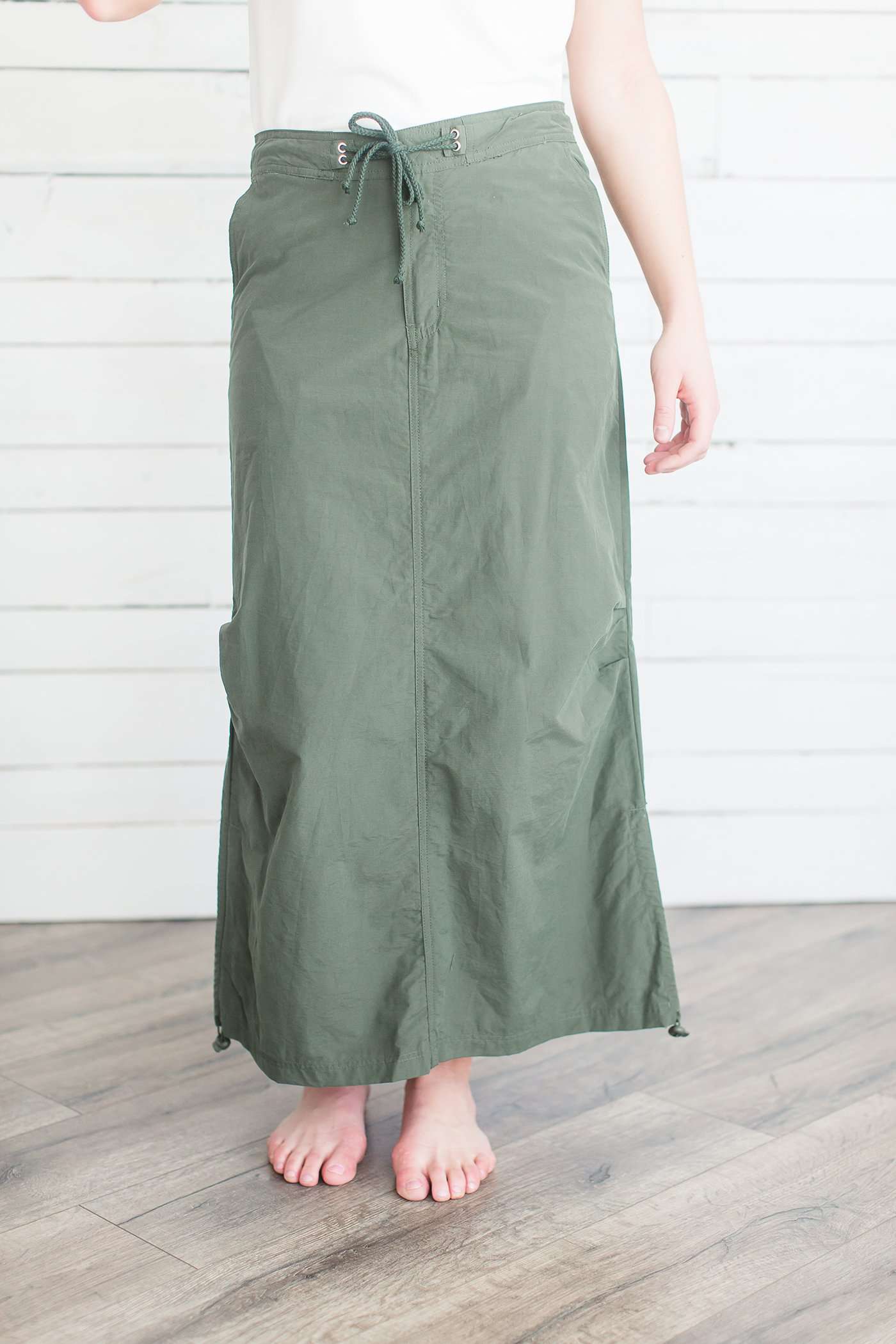 Black, tan or olive option in this long skirt with drawstring waist and side strings to adjust height from midi to maxi