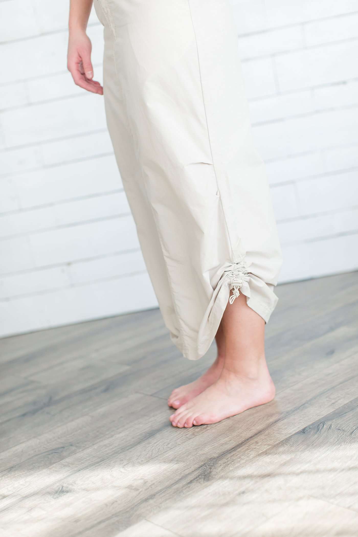 Black, tan or olive option in this long skirt with drawstring waist and side strings to adjust height from midi to maxi
