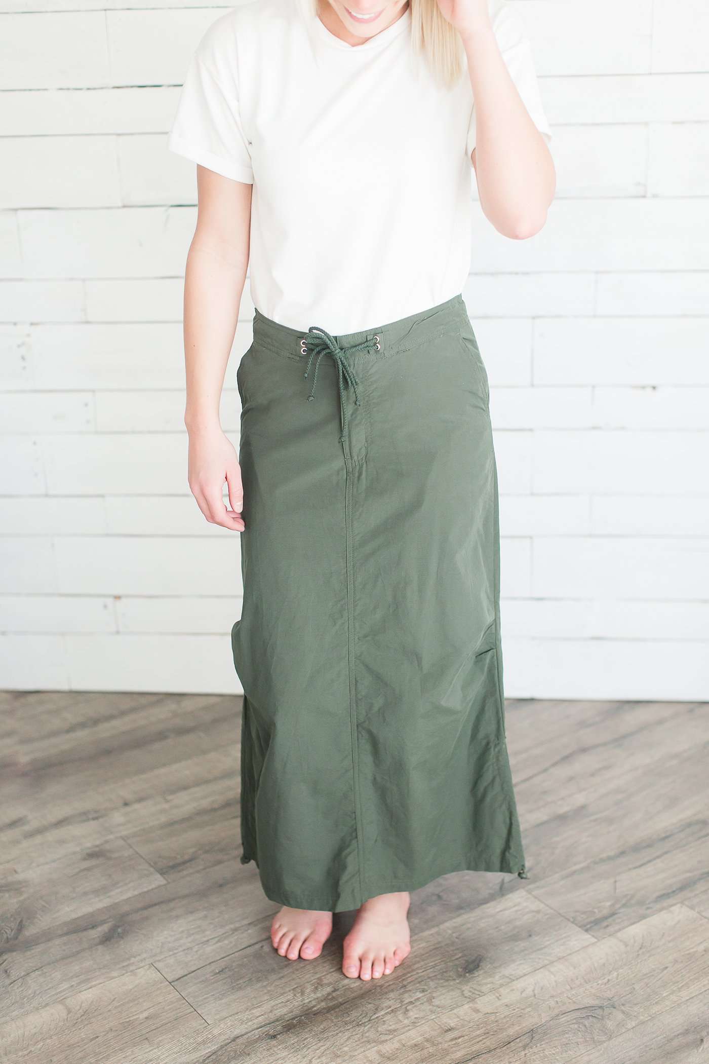 Black, tan or olive option in this long skirt with drawstring waist and side strings to adjust height from midi to maxi