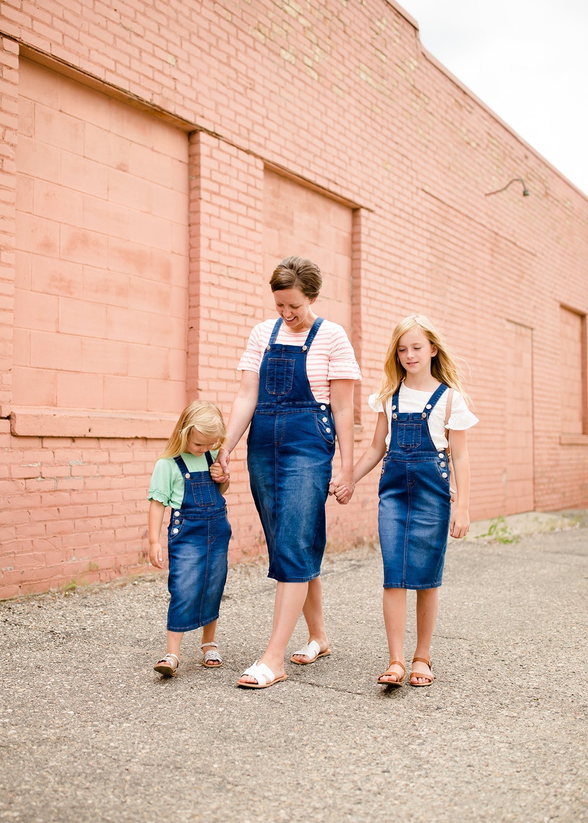 woman in a modest denim overall jumper dress