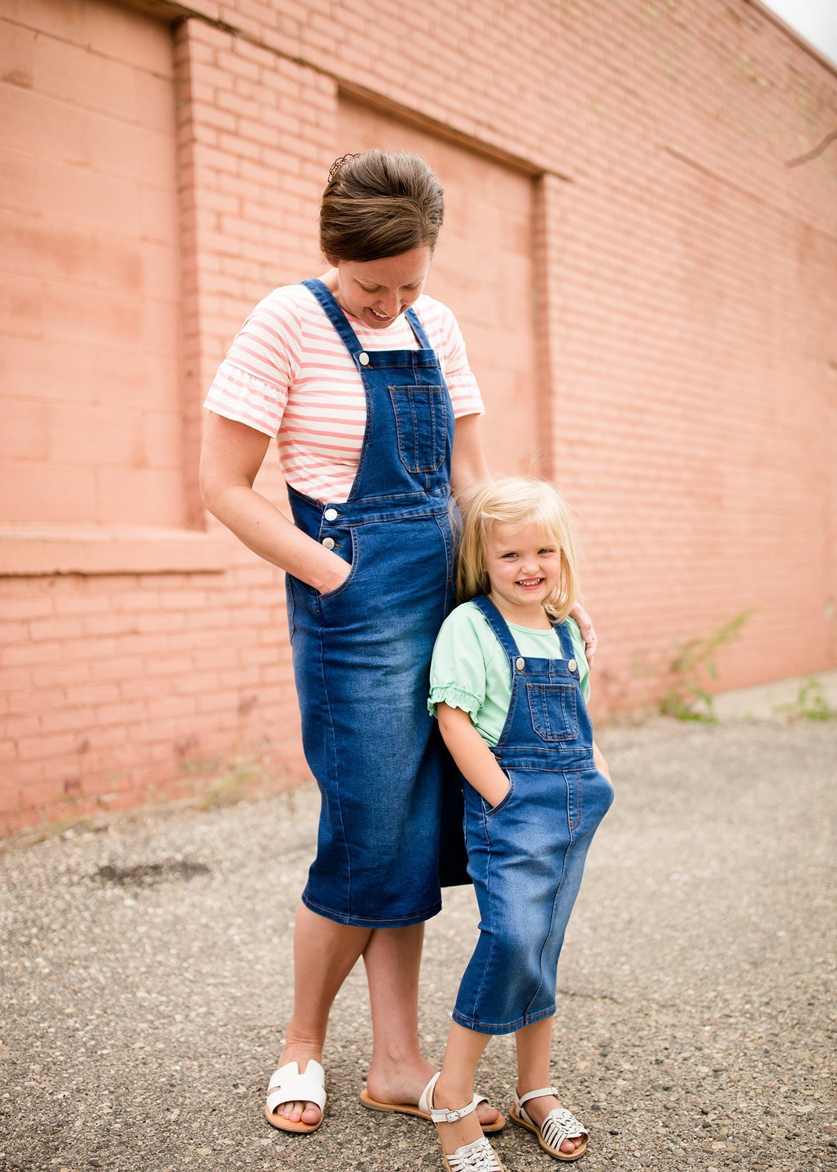 woman in a modest denim overall jumper dress