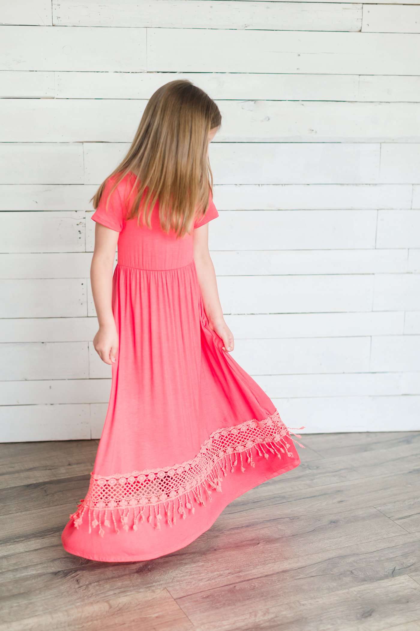 coral or mint colored short sleeve girls maxi dress with crochet detail at the bottom and elastic waist.