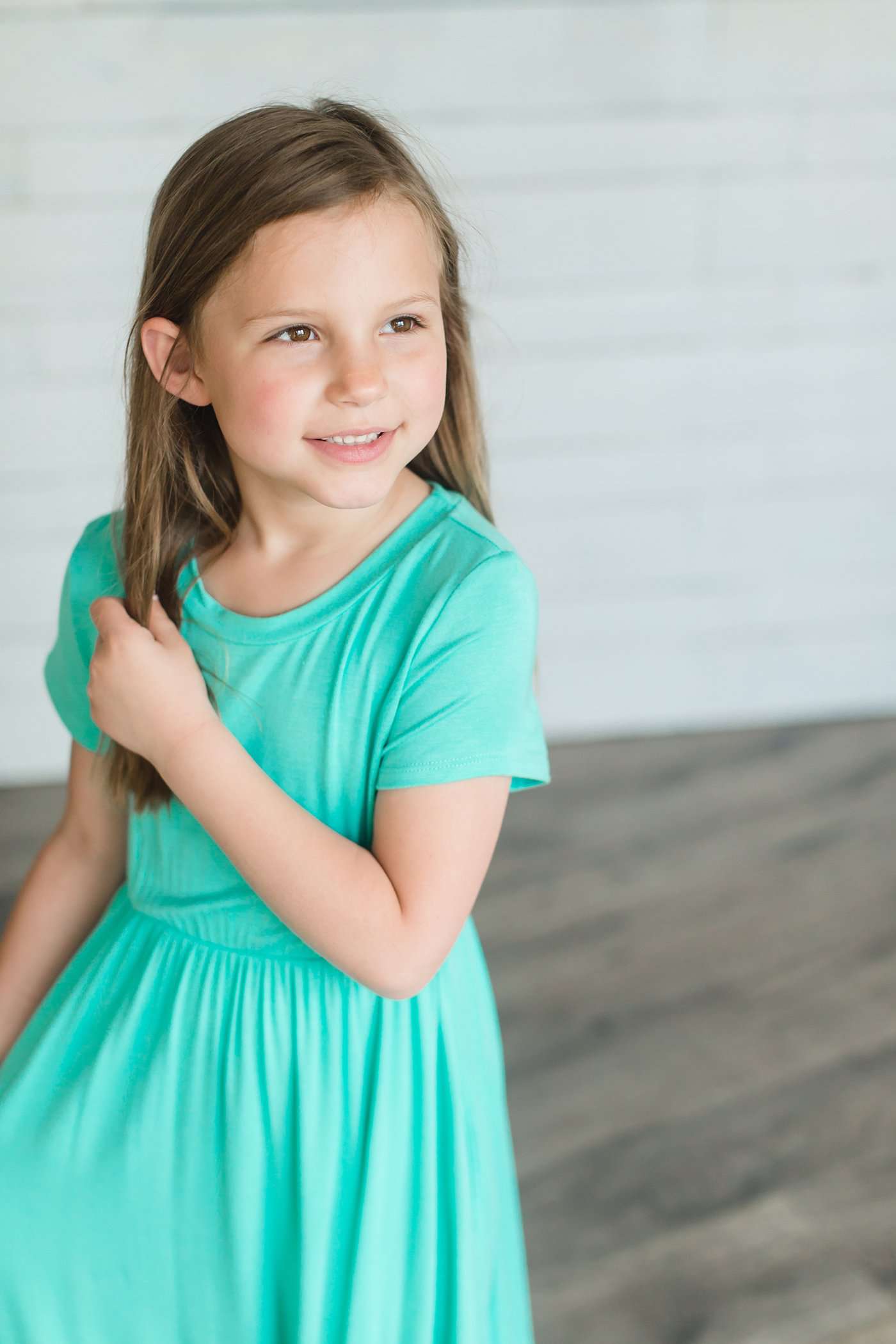 coral or mint colored short sleeve girls maxi dress with crochet detail at the bottom and elastic waist.