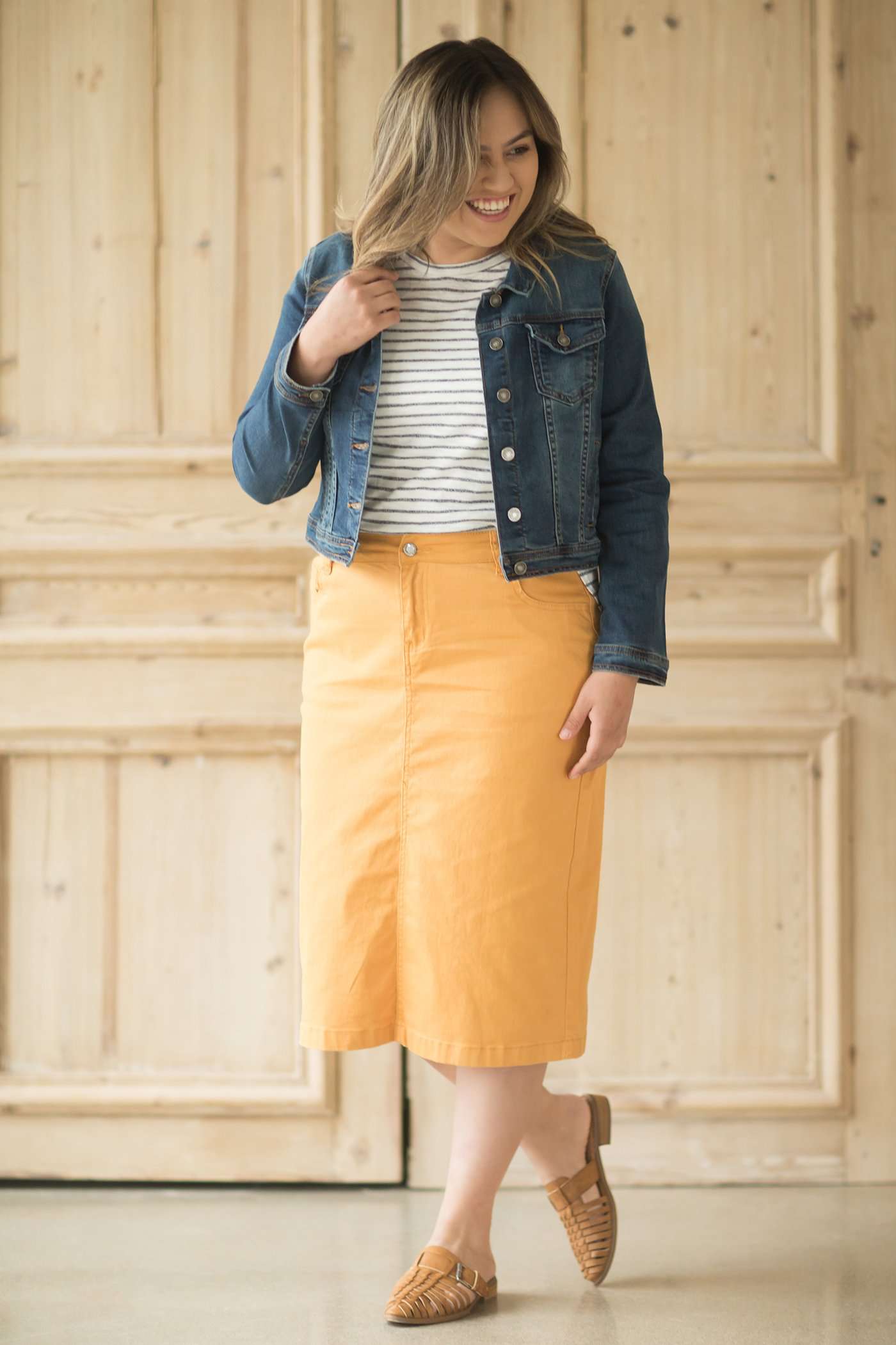 Dandelion colored denim skirt below the knee.