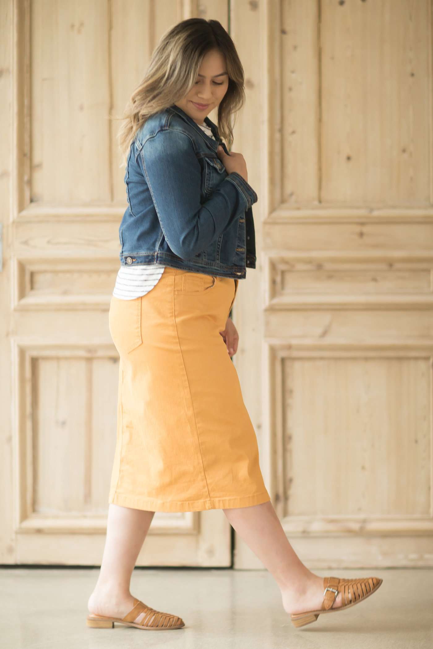 Dandelion colored denim skirt below the knee.