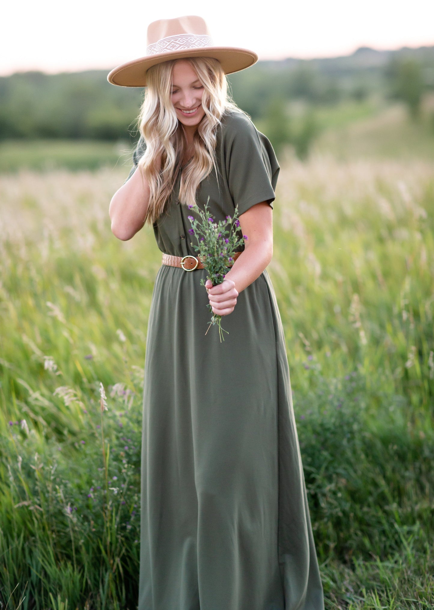 Made from an elevated ponte fabric, the Ella Cinched Waist Maxi Dress is an Inherit Design that will take you from season to season. There are non-functioning tortoise shell buttons down the front to ensure a modest fit. The top of the dress has a dolman fit and drop arms to keep you comfortable and give a flattering fit!
