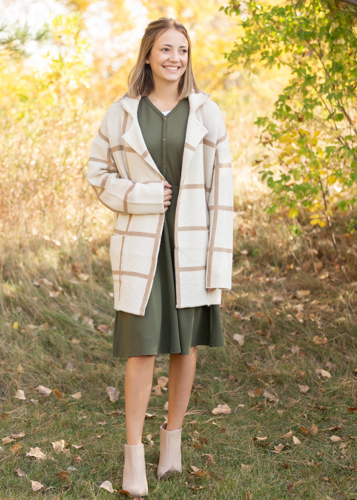 Made from an elevated ponte fabric, the Ella Cinched Waist Midi Dress is an Inherit Design that will take you from season to season. There are non-functioning tortoise shell buttons down the front to ensure a modest fit. The top of the dress has a dolman fit and drop arms to keep you comfortable and give a flattering fit! The skirt of the dress has a slight a-line making this a super versatile dress!