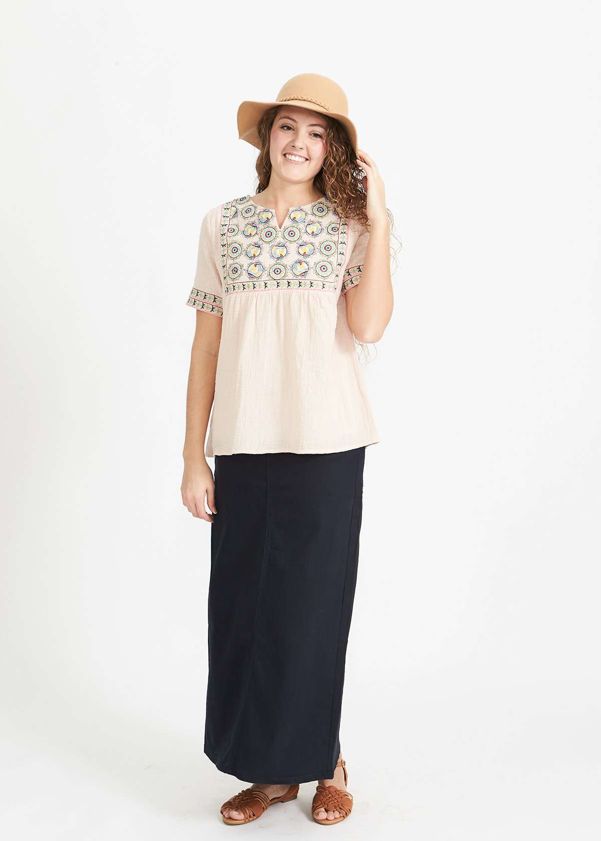 Woman wearing a blush embroidered bohemian style top