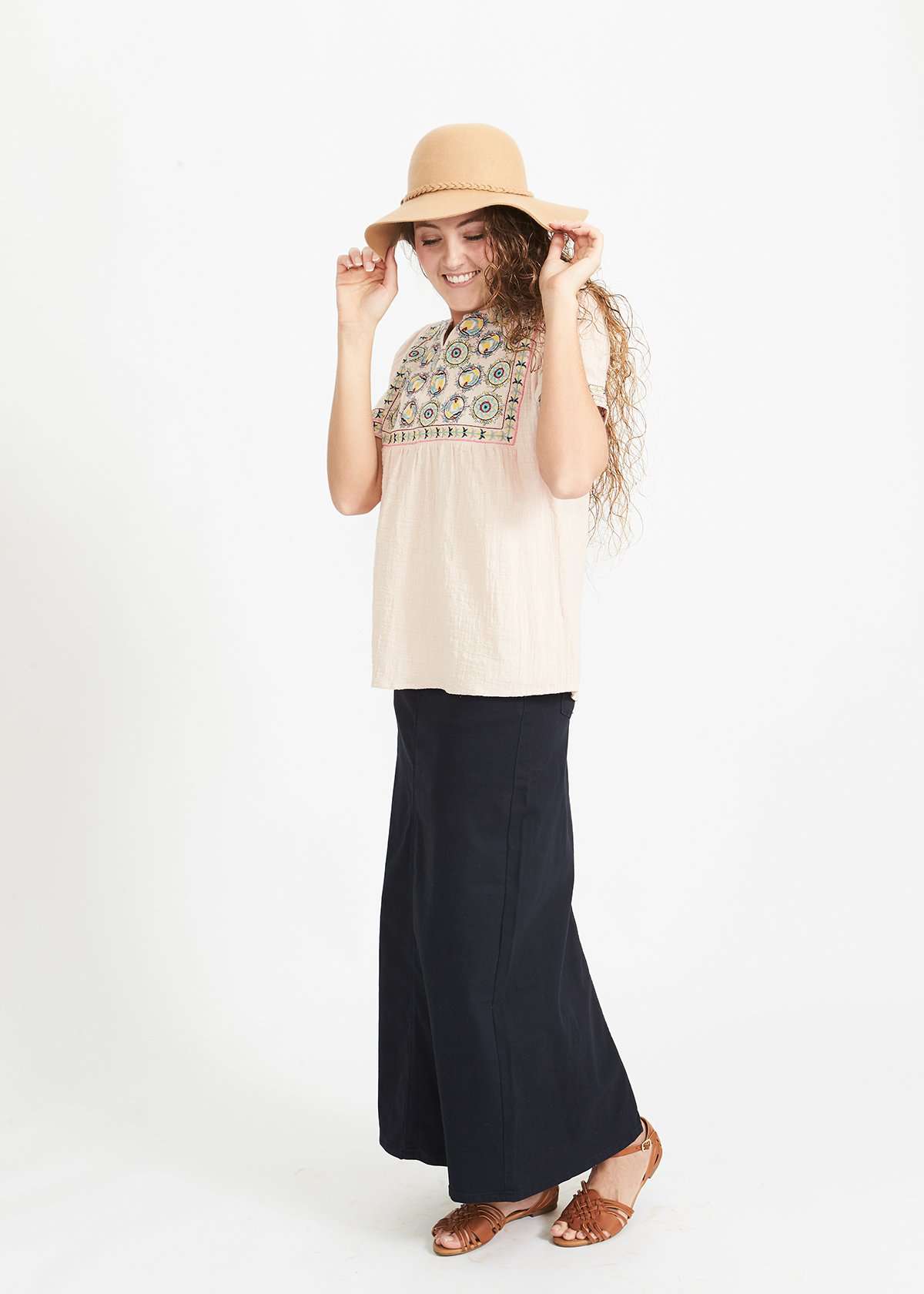 Woman wearing a blush embroidered bohemian style top