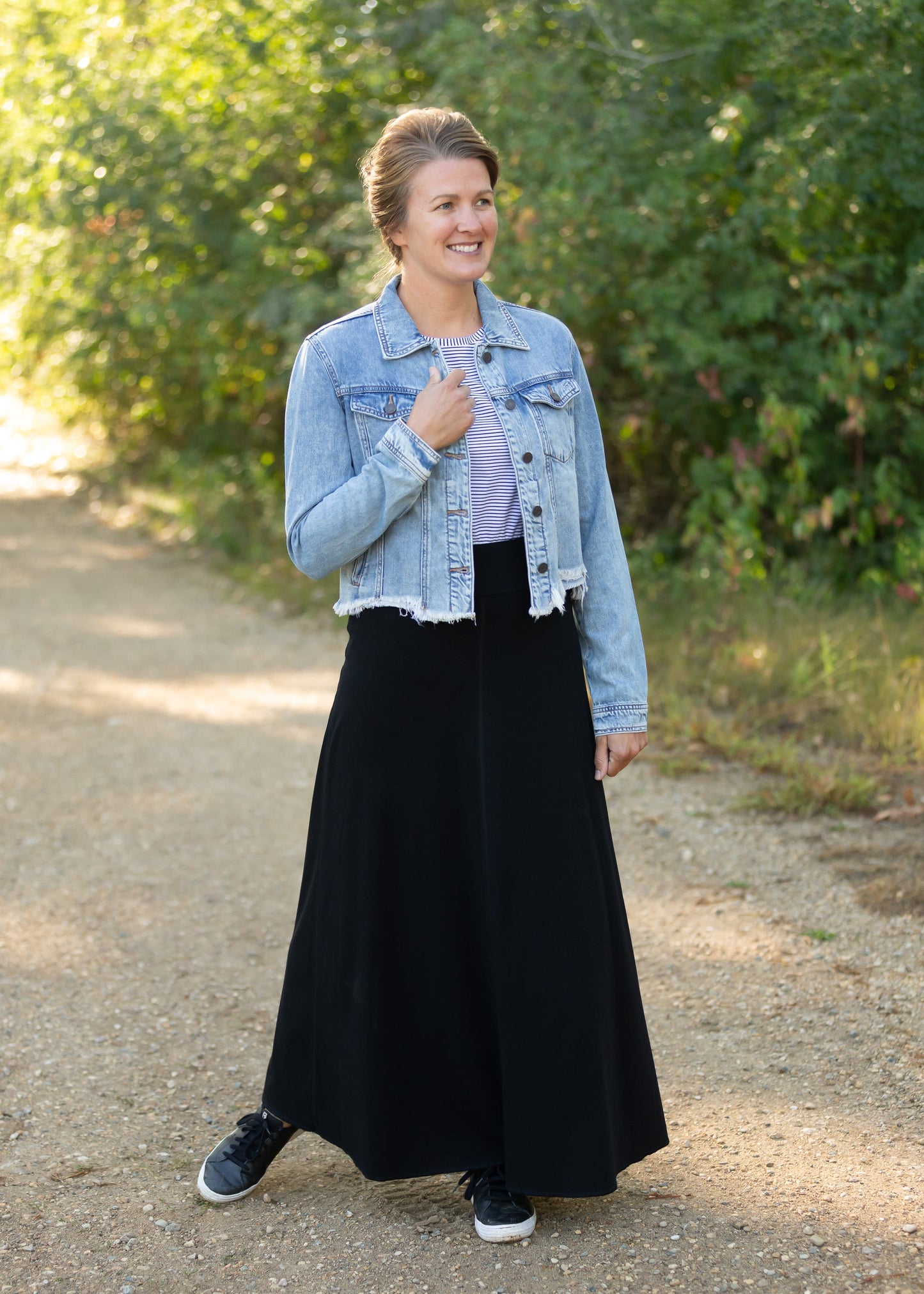 Frayed Light Wash Denim Jean Jacket with brass front buttons, a classic collar and a frayed hem.