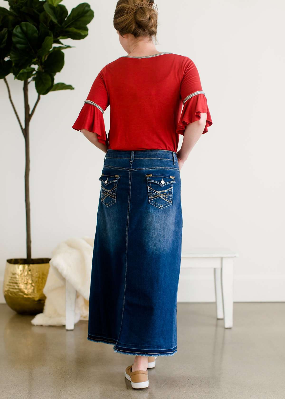 A-line long denim skirt with no slit and a raw edge hem.