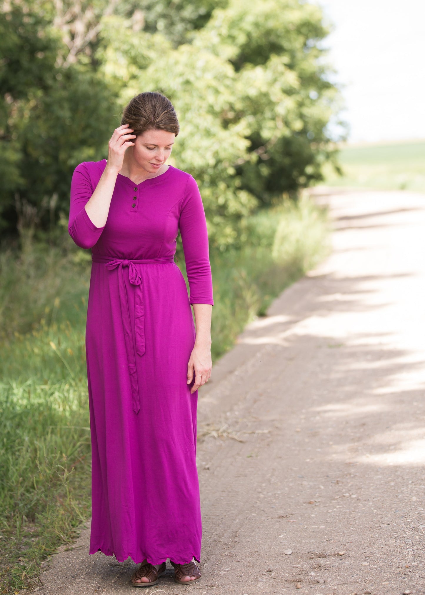 Women's long pink maxi dress that is fully lined, nursing friendly and comes with a belt