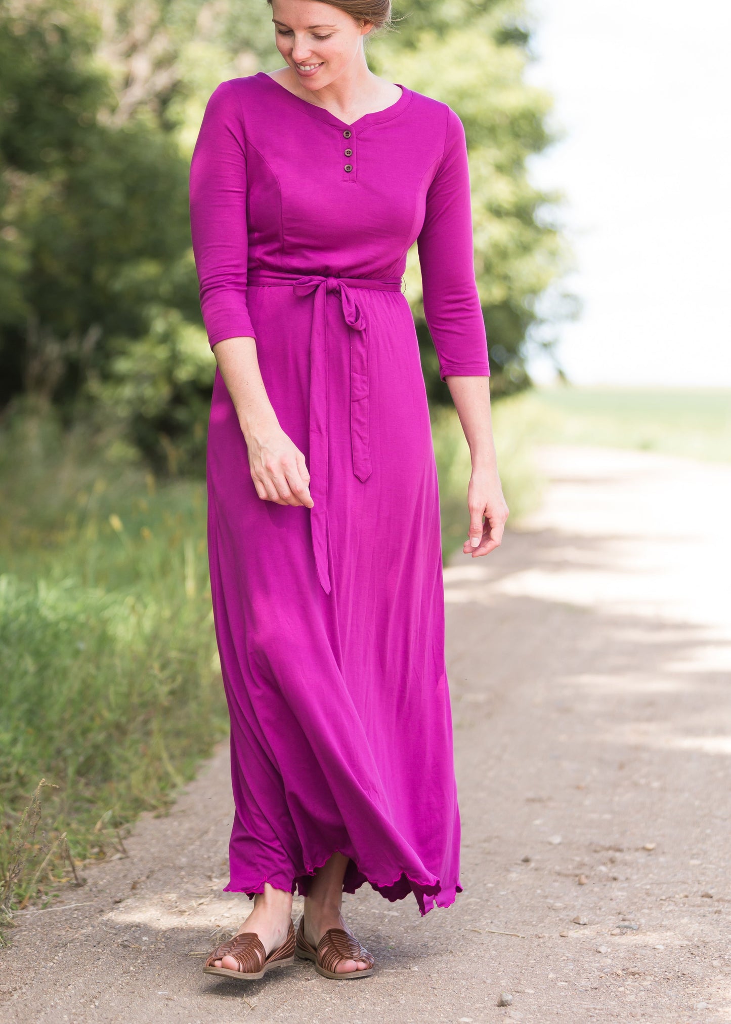 Women's long pink maxi dress that is fully lined, nursing friendly and comes with a belt