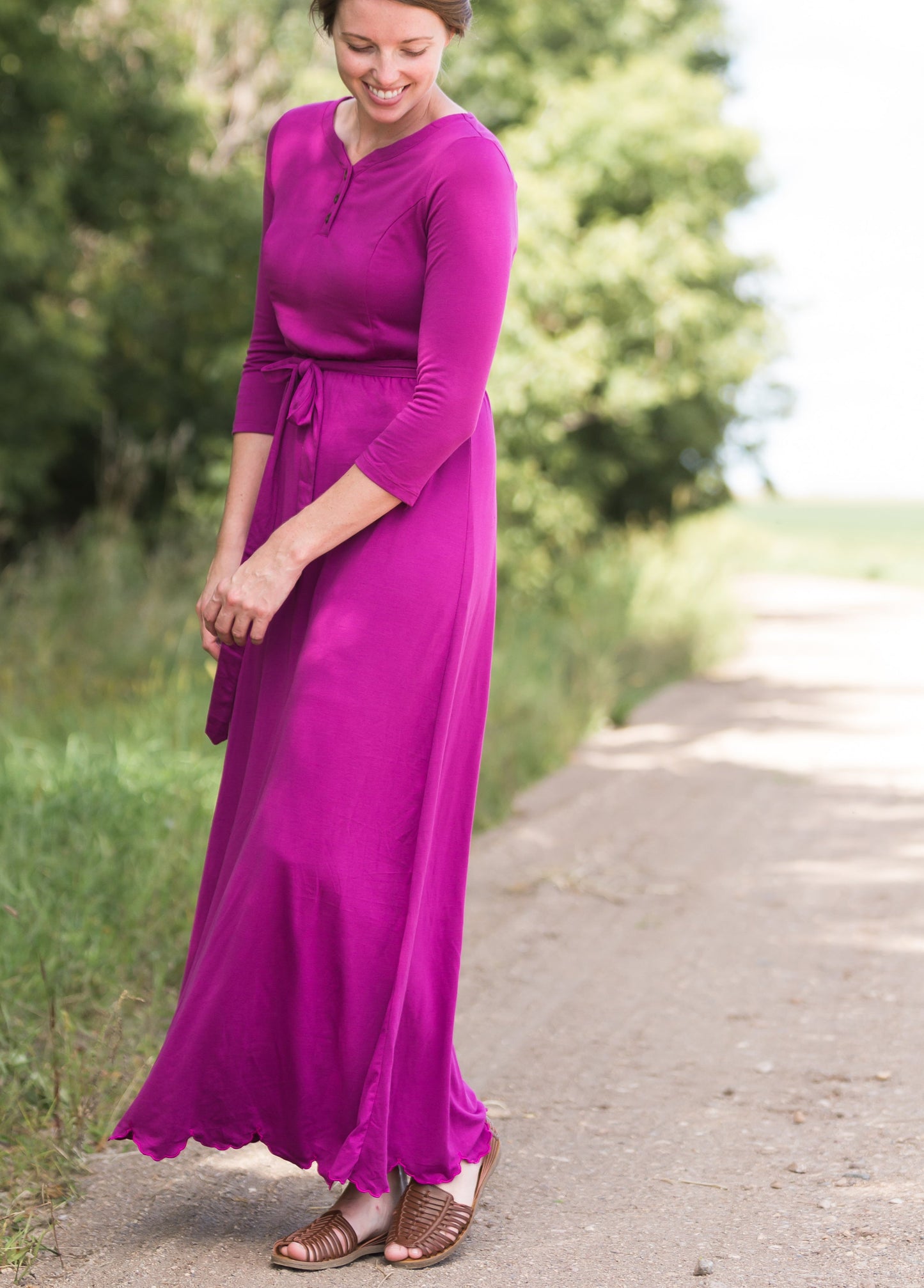 Women's long pink maxi dress that is fully lined, nursing friendly and comes with a belt