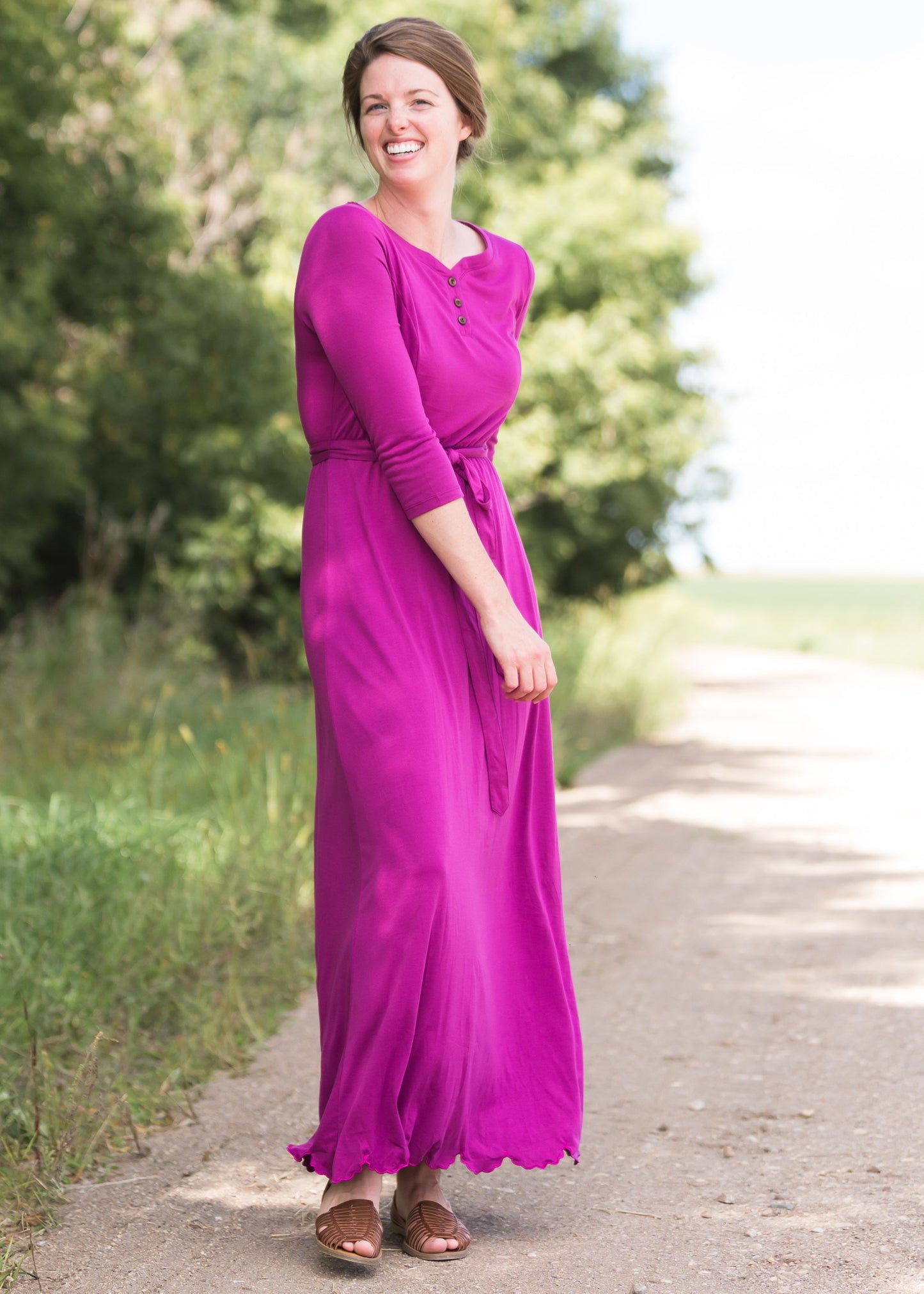 Women's long pink maxi dress that is fully lined, nursing friendly and comes with a belt