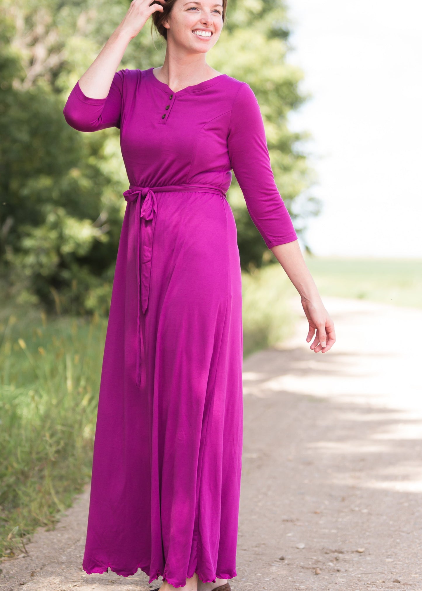 Women's long pink maxi dress that is fully lined, nursing friendly and comes with a belt