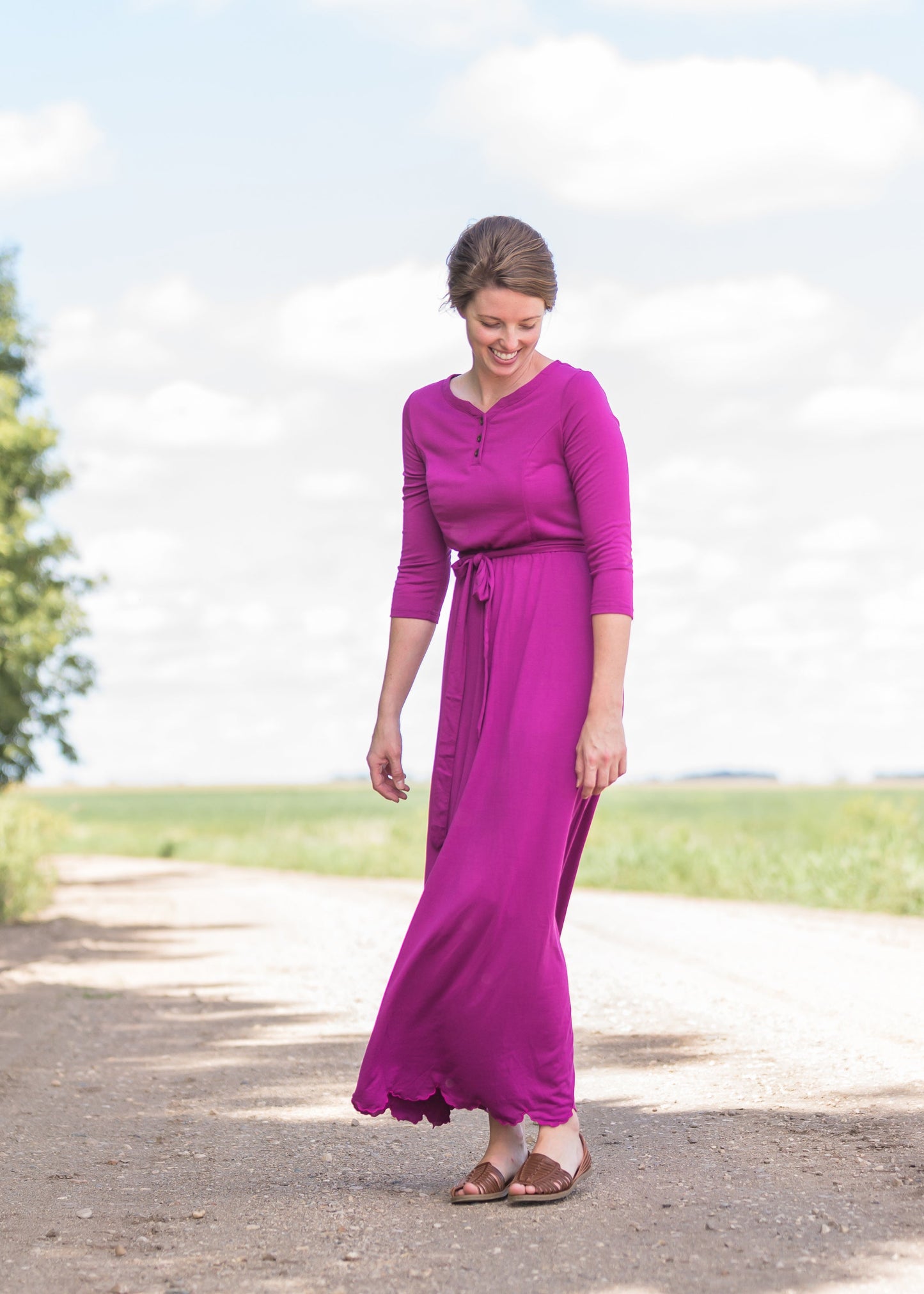 Women's long pink maxi dress that is fully lined, nursing friendly and comes with a belt