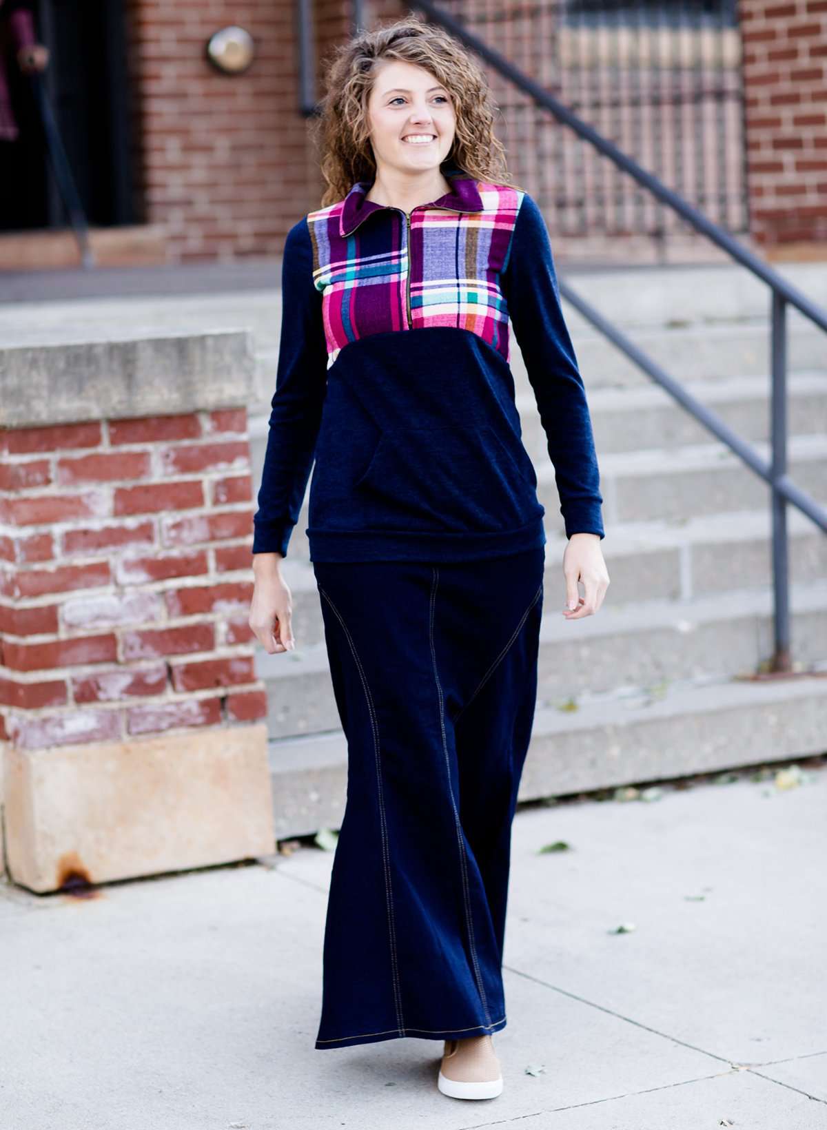 This half zip pullover features a front pouch pocket and a beautiful color block print of fuchsia, teal and mustard! It also is a mommy and me style.
