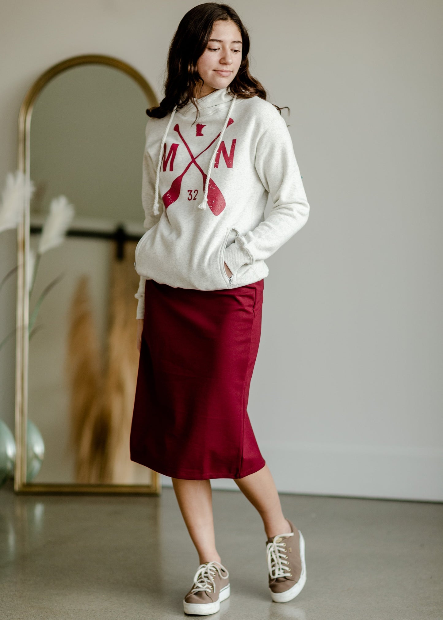 This is the quinn knit midi skirt that is made of high quality knit with a stretch waistband and is in a streight fit.