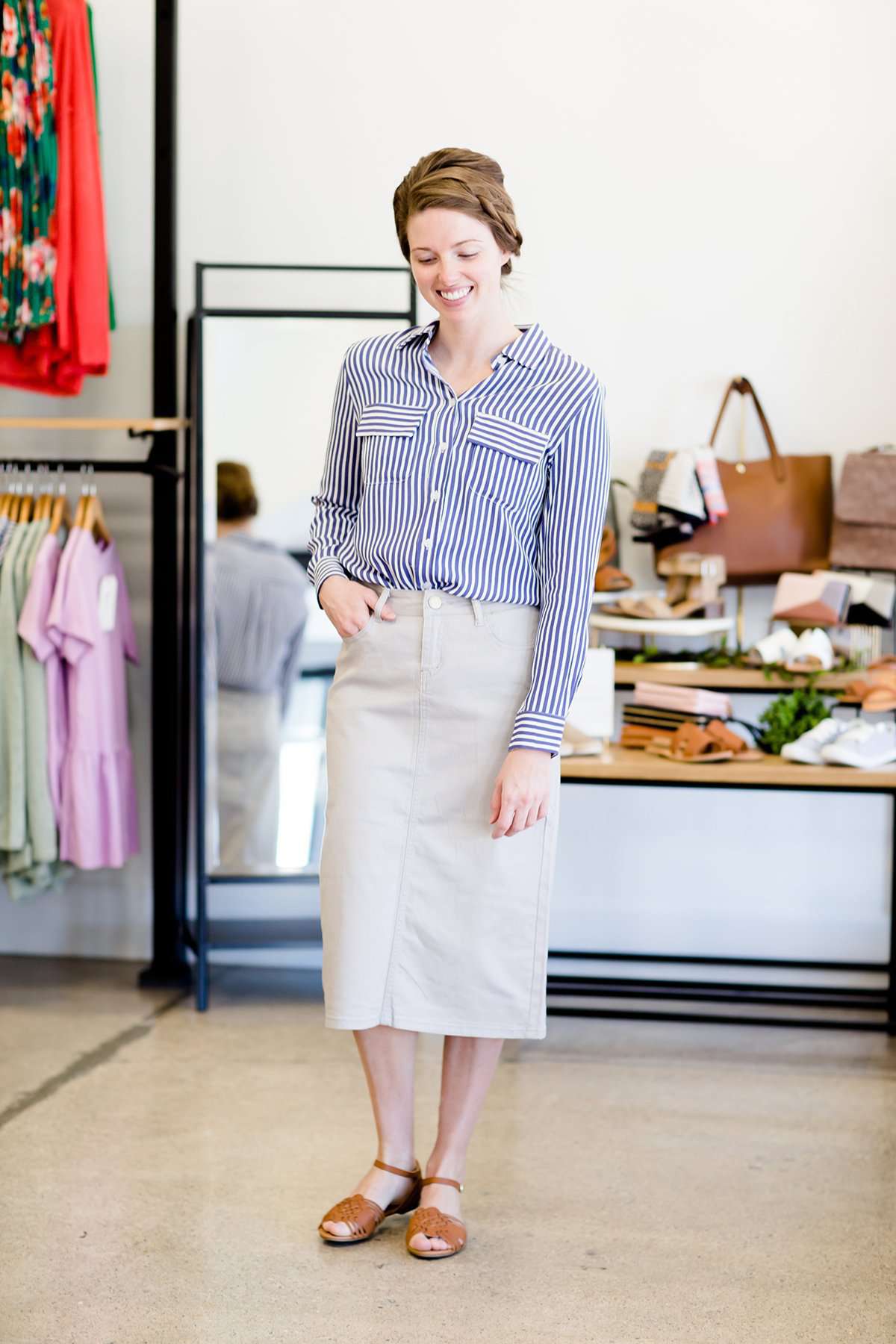 Woman wearing a gray below the knee skirt