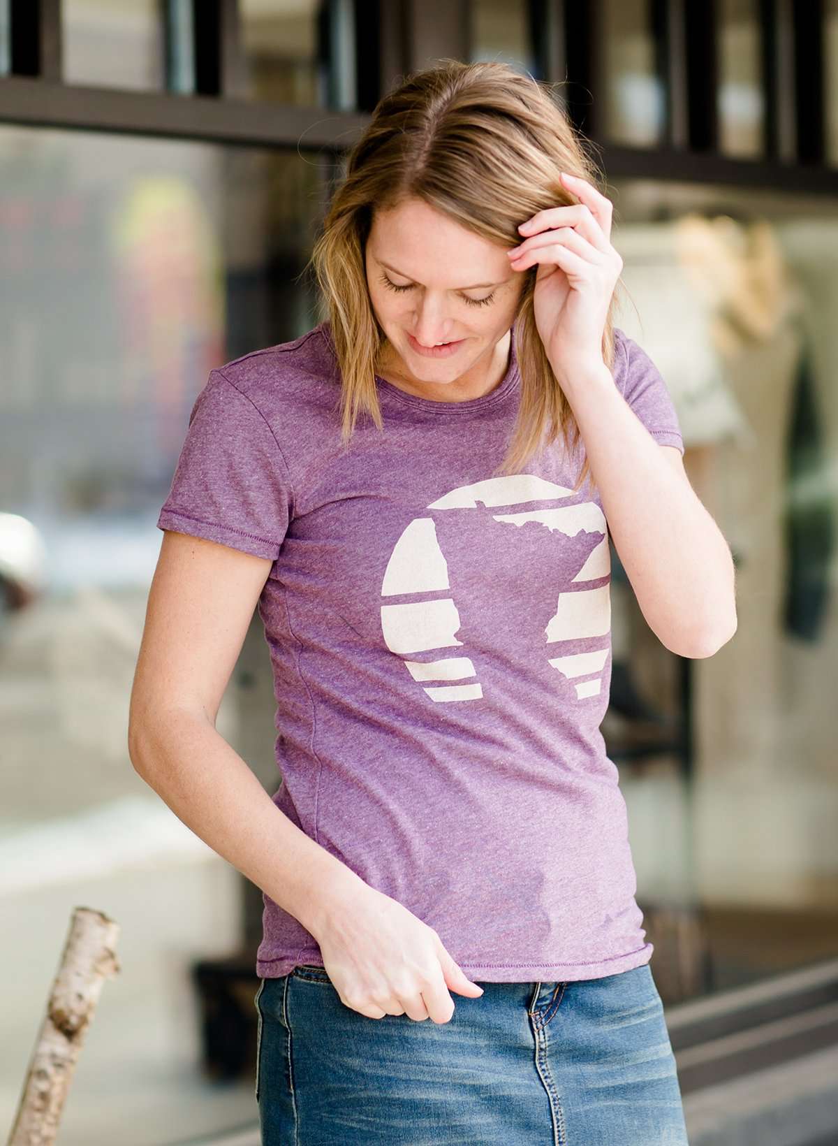 Mauve and Olive Minnesota screen printed tee shirt. These shirts are worn by a model standing in front of Inherit Clothing Company.