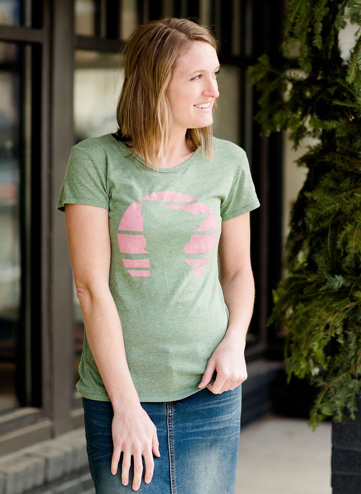 Mauve and Olive Minnesota screen printed tee shirt. These shirts are worn by a model standing in front of Inherit Clothing Company.