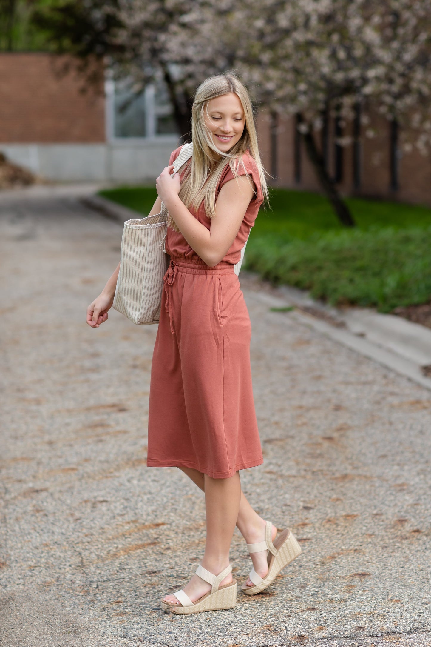 Your favorite dress is back in a brand new color! The Sami Terracotta Knit Midi Dress from our Inherit Name-sake label is the best dress for so many reasons. It drapes beautifully and feels casual, but looks so refined and feminine. The soft fabric has a bit of stretch and the sleeve length is very flattering. Tie waist for customizable fit and did we mention it has pockets?