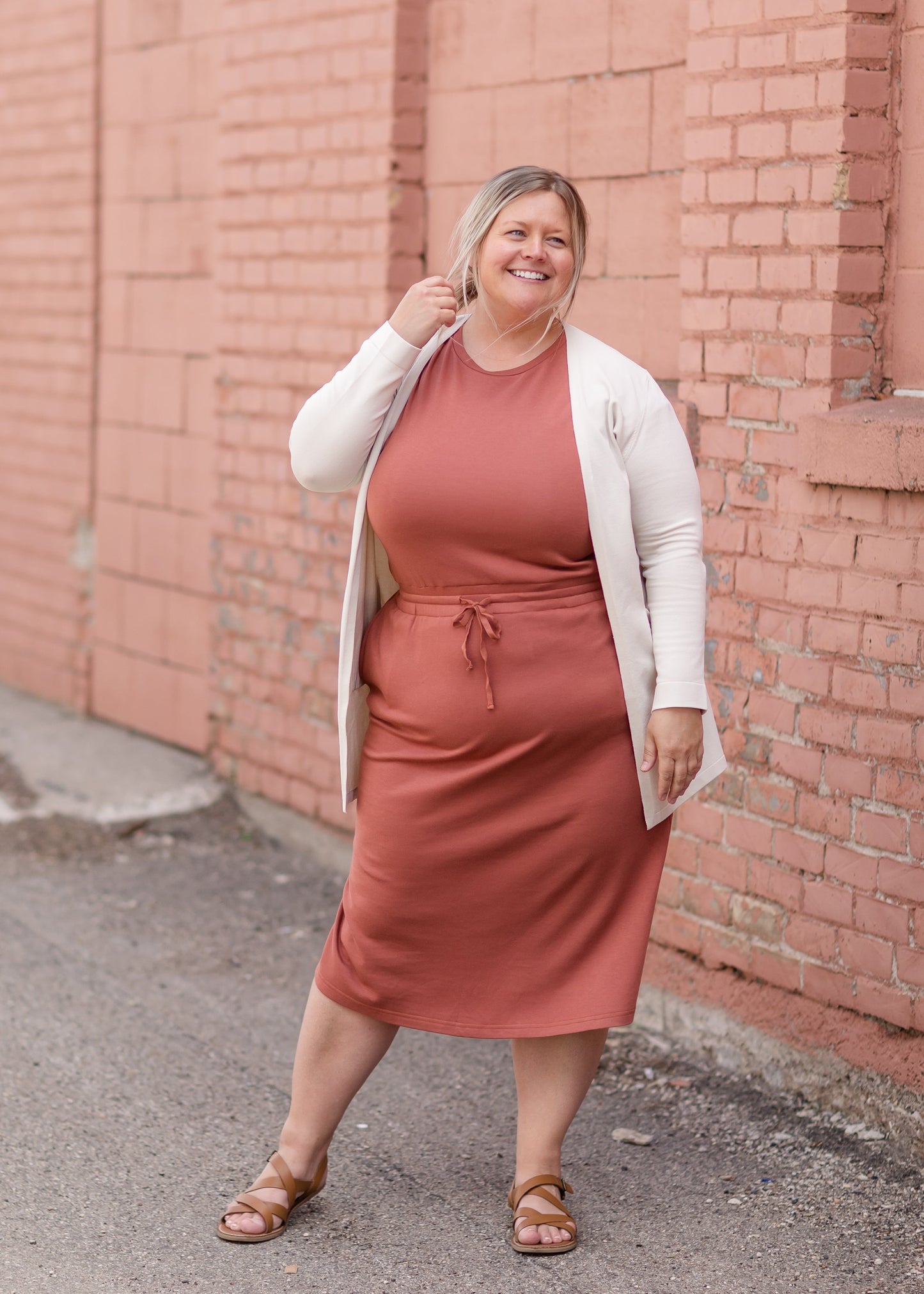 Your favorite dress is back in a brand new color! The Sami Terracotta Knit Midi Dress from our Inherit Name-sake label is the best dress for so many reasons. It drapes beautifully and feels casual, but looks so refined and feminine. The soft fabric has a bit of stretch and the sleeve length is very flattering. Tie waist for customizable fit and did we mention it has pockets?